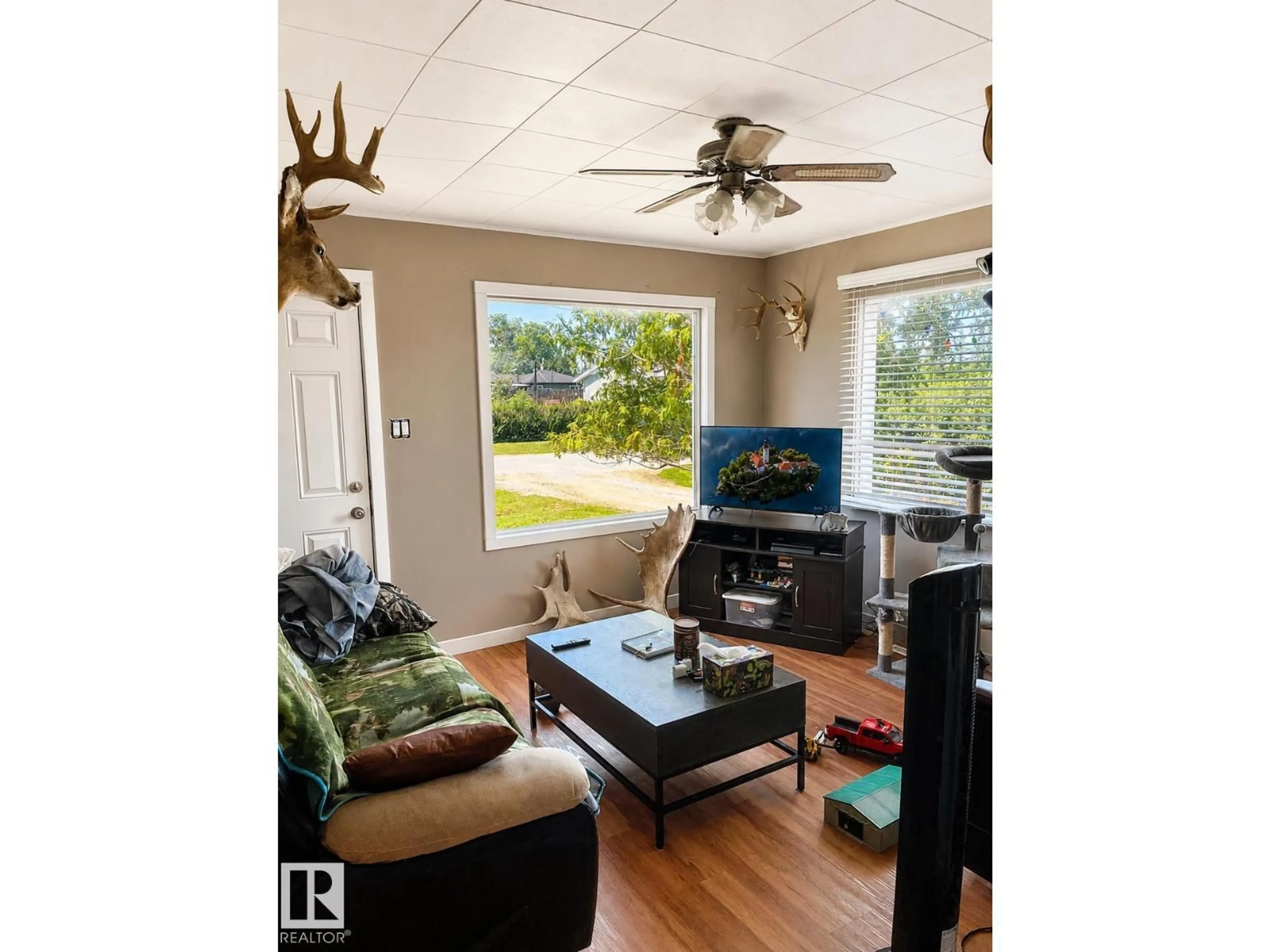 Living room with furniture, wood/laminate floor for 4817 52 ST, Glendon Alberta T0A1P0