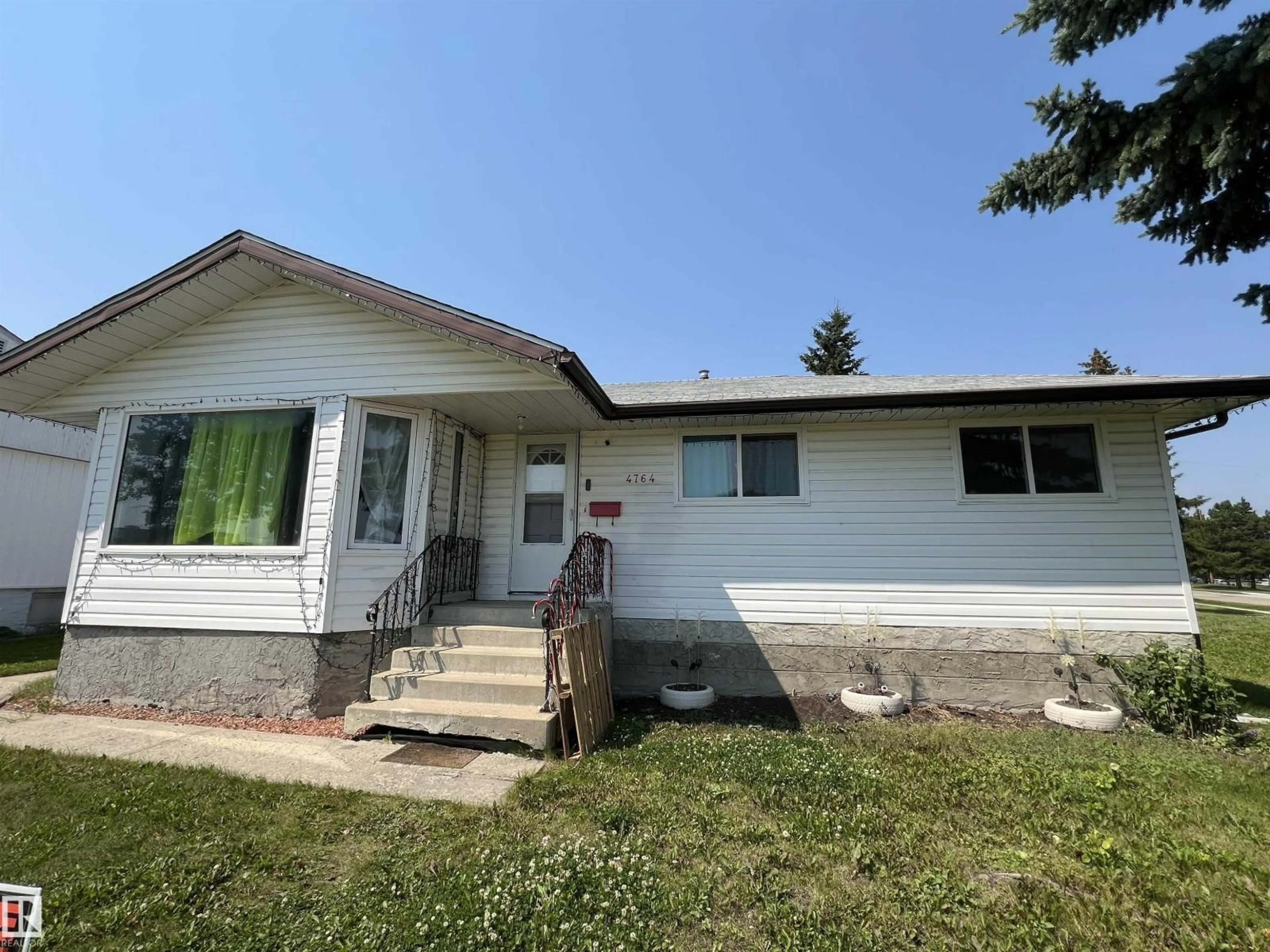 Home with vinyl exterior material, street for 4764 43 ST, Drayton Valley Alberta T7A1G1