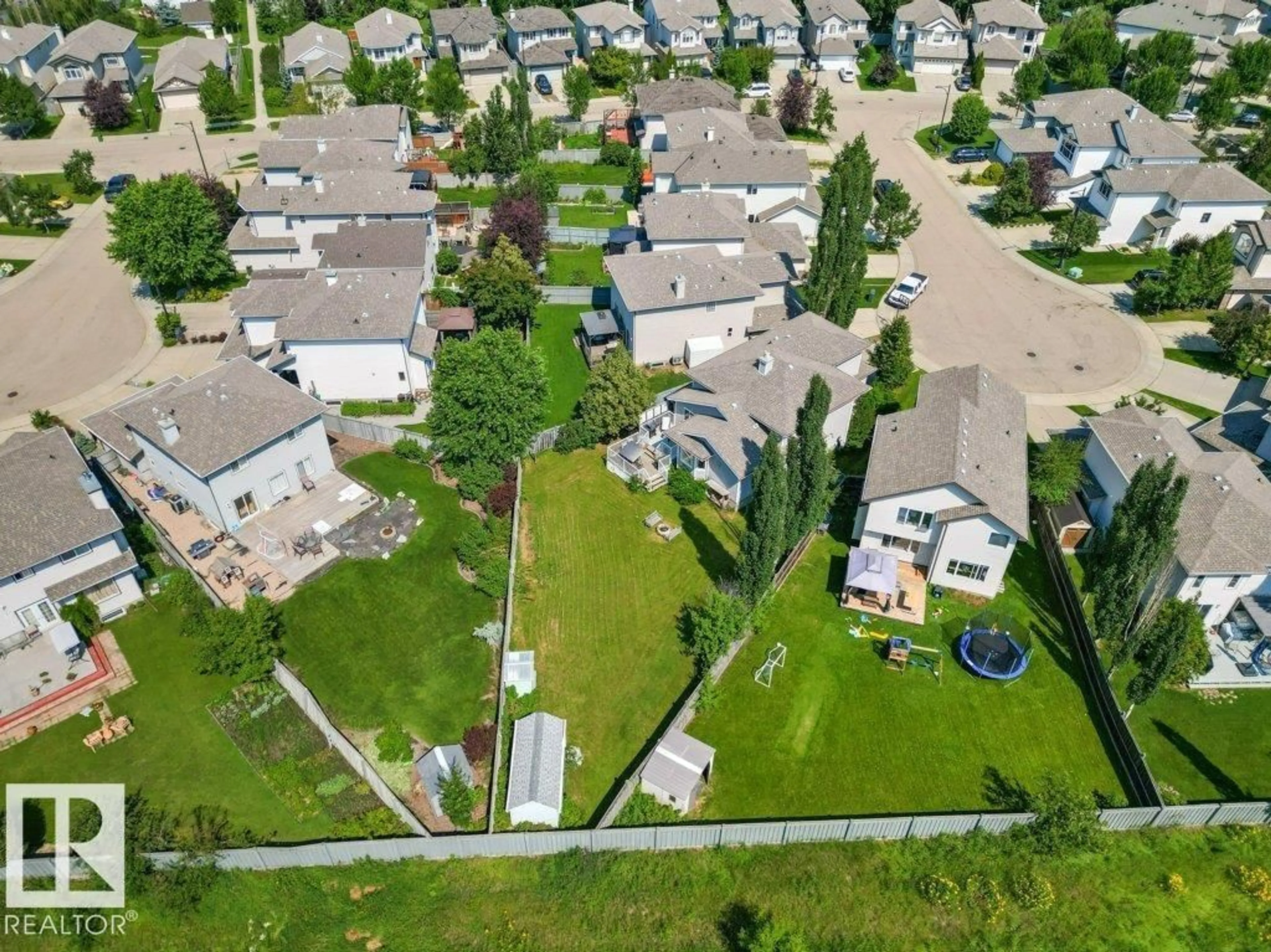 A pic from outside/outdoor area/front of a property/back of a property/a pic from drone, street for 4512 210 ST, Edmonton Alberta T6M0G5