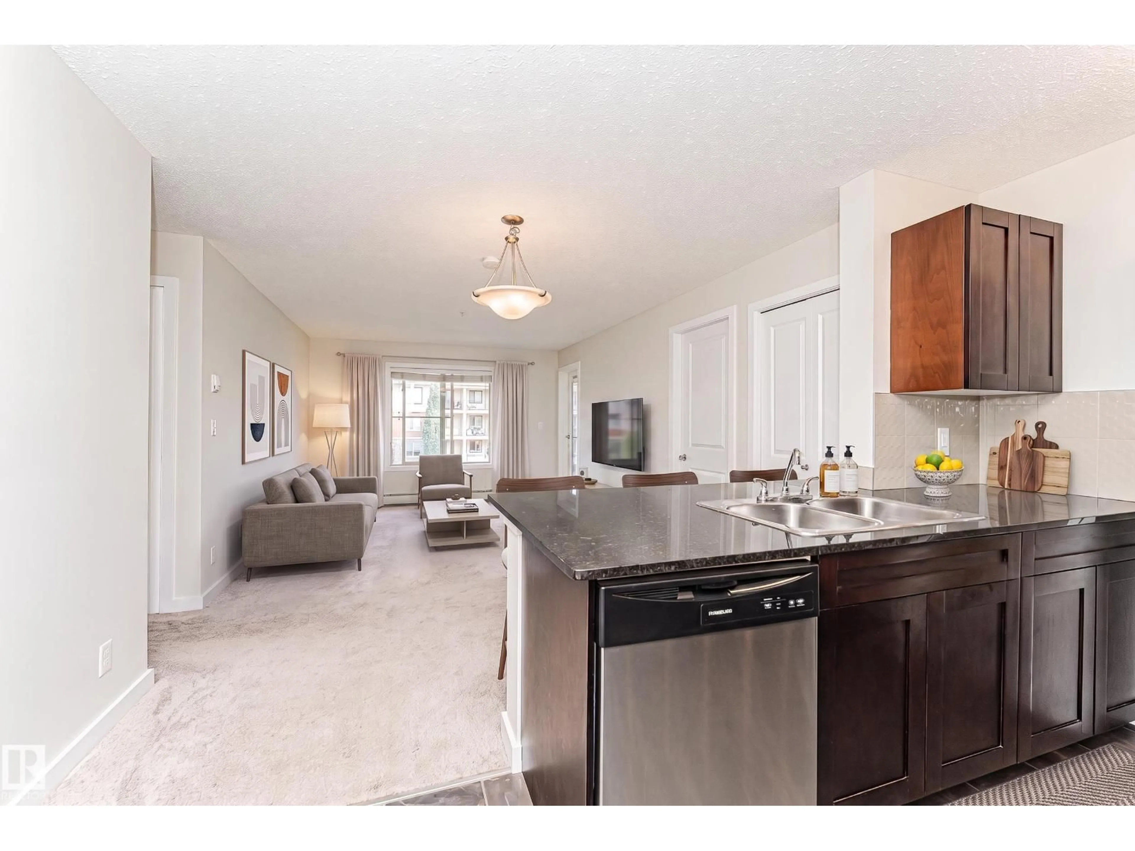 Open concept kitchen, ceramic/tile floor for #322 - 5816 MULLEN PL, Edmonton Alberta T6R0W3