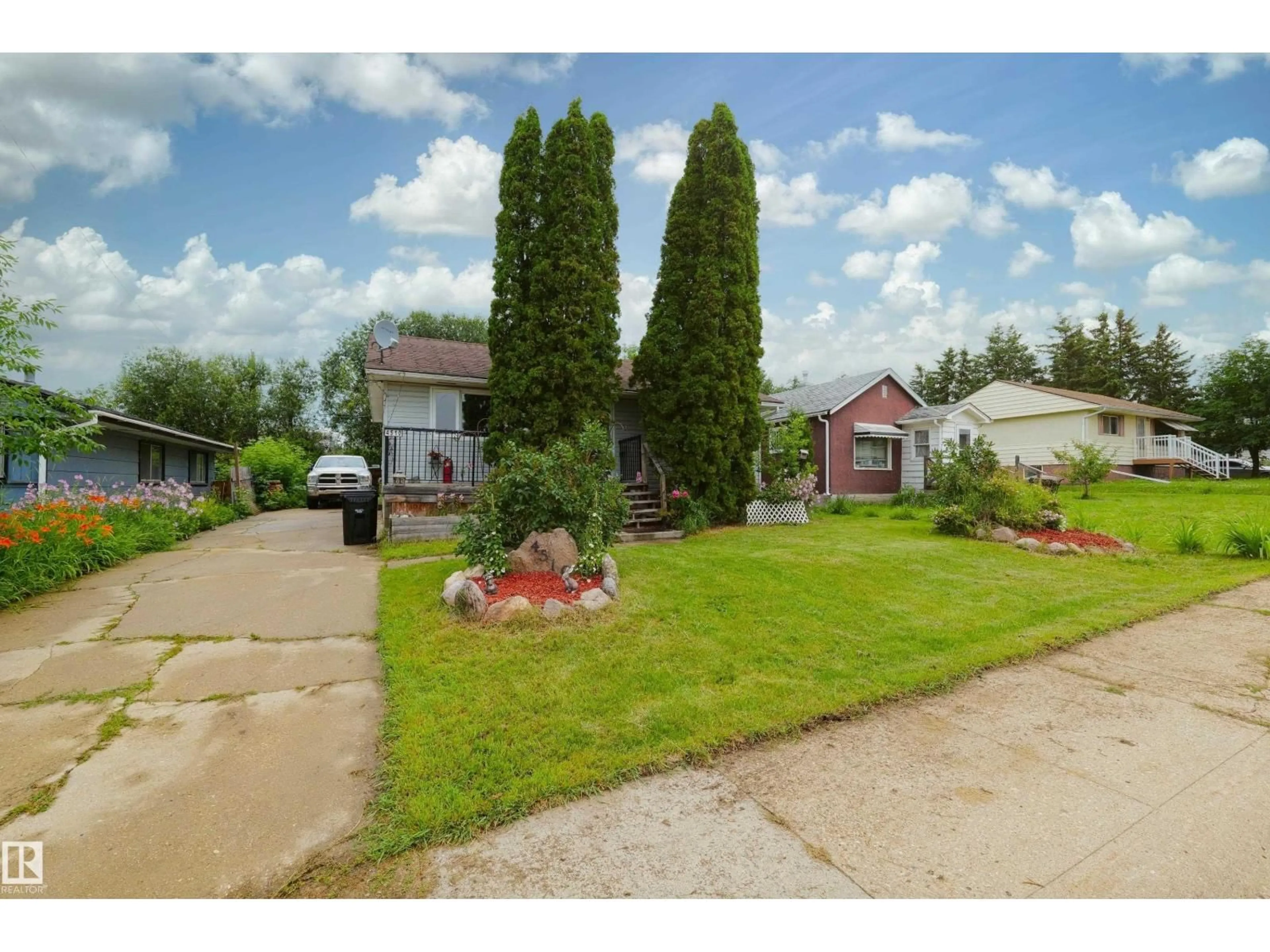 A pic from outside/outdoor area/front of a property/back of a property/a pic from drone, street for 4510 55 AVENUE, Barrhead Alberta T7N1K1