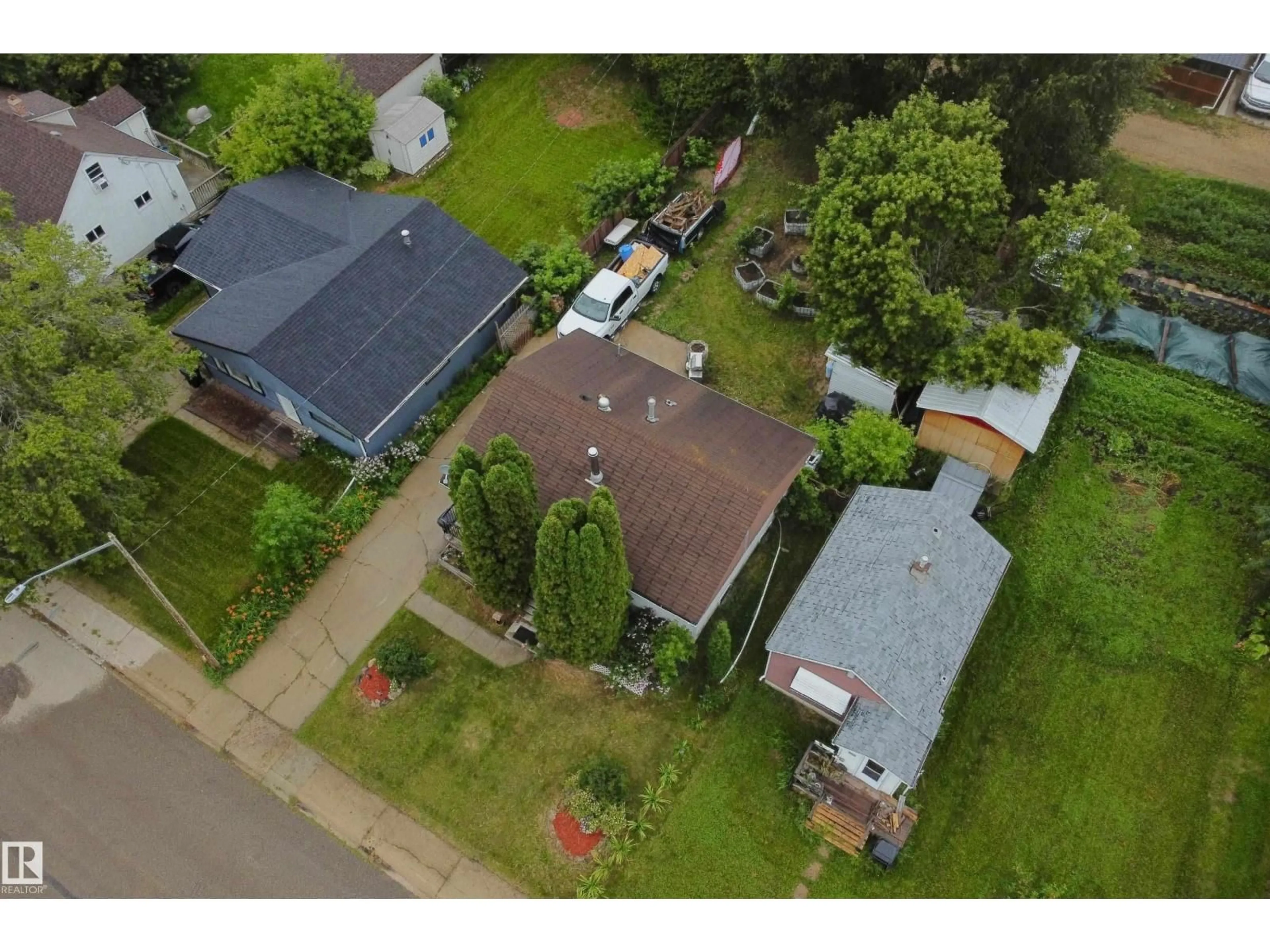 A pic from outside/outdoor area/front of a property/back of a property/a pic from drone, street for 4510 55 AVENUE, Barrhead Alberta T7N1K1
