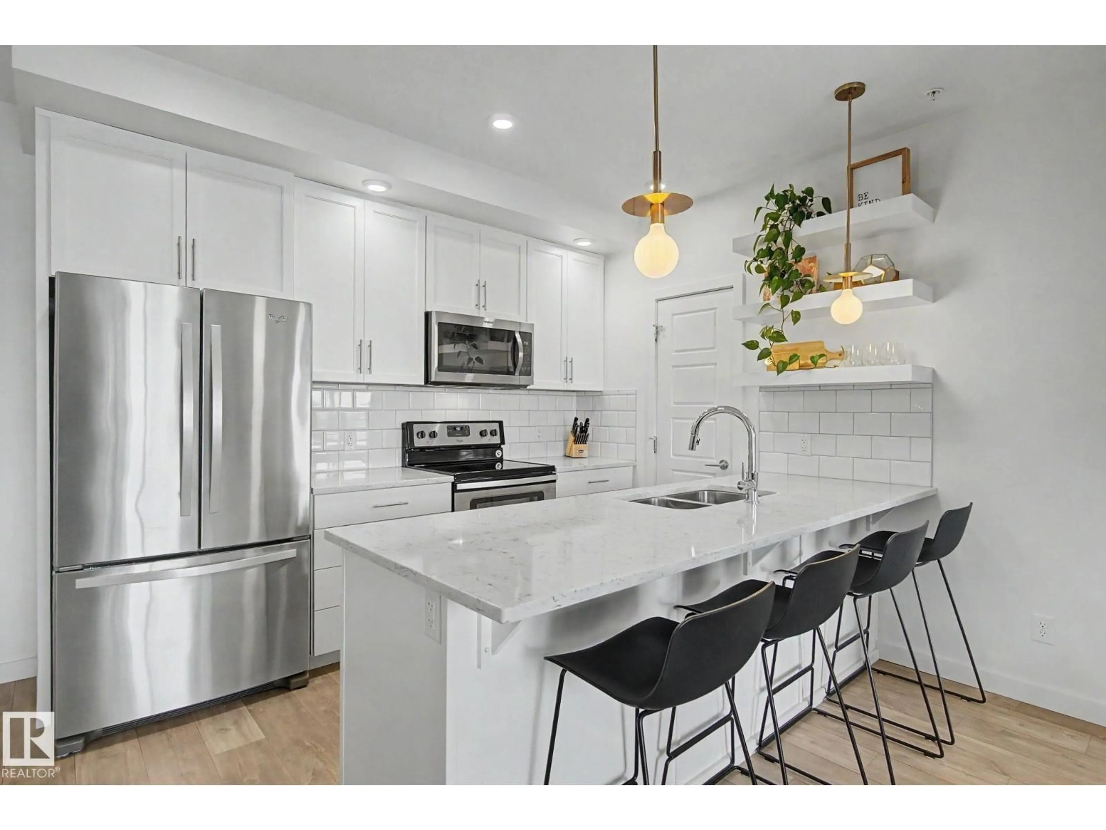 Open concept kitchen, ceramic/tile floor for #435 - 1008 ROSENTHAL BV, Edmonton Alberta T5T7C6