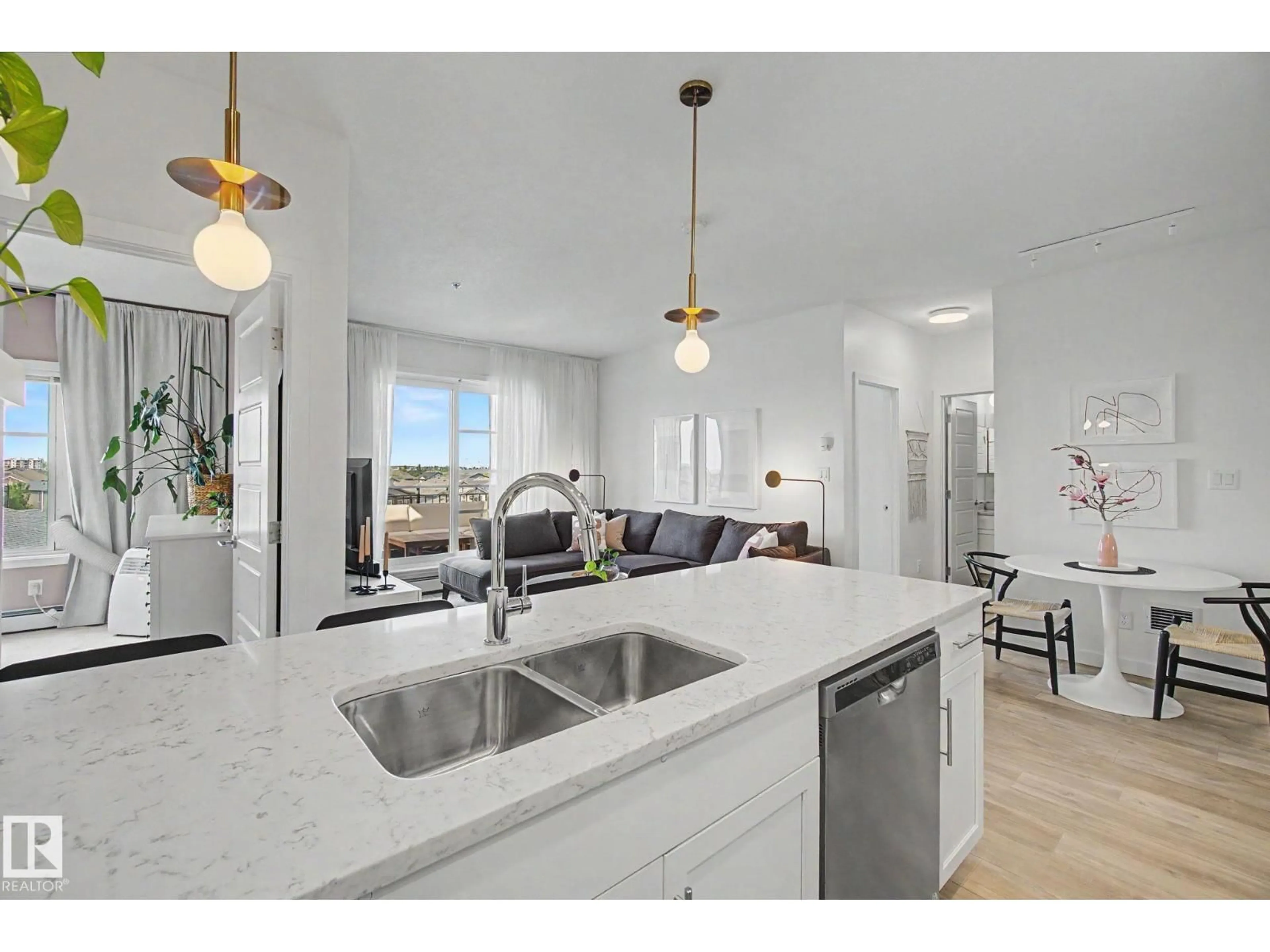 Open concept kitchen, ceramic/tile floor for #435 - 1008 ROSENTHAL BV, Edmonton Alberta T5T7C6
