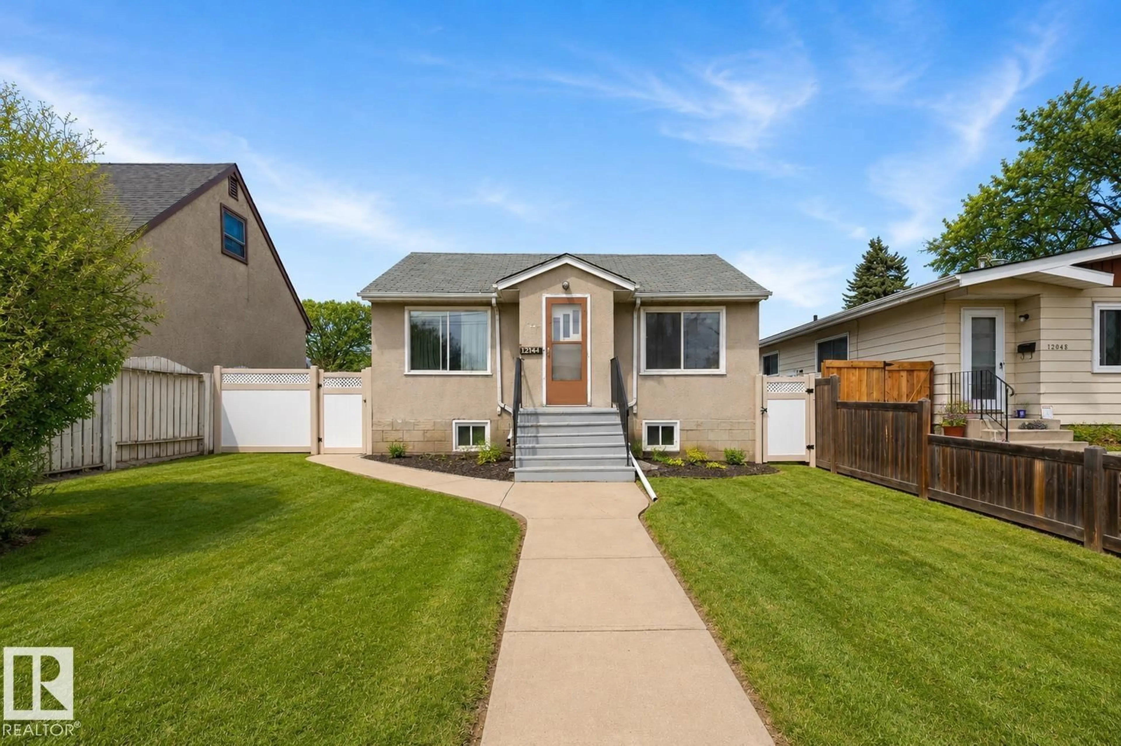 Home with vinyl exterior material, street for NW - 12044 50 ST, Edmonton Alberta T5W3C4