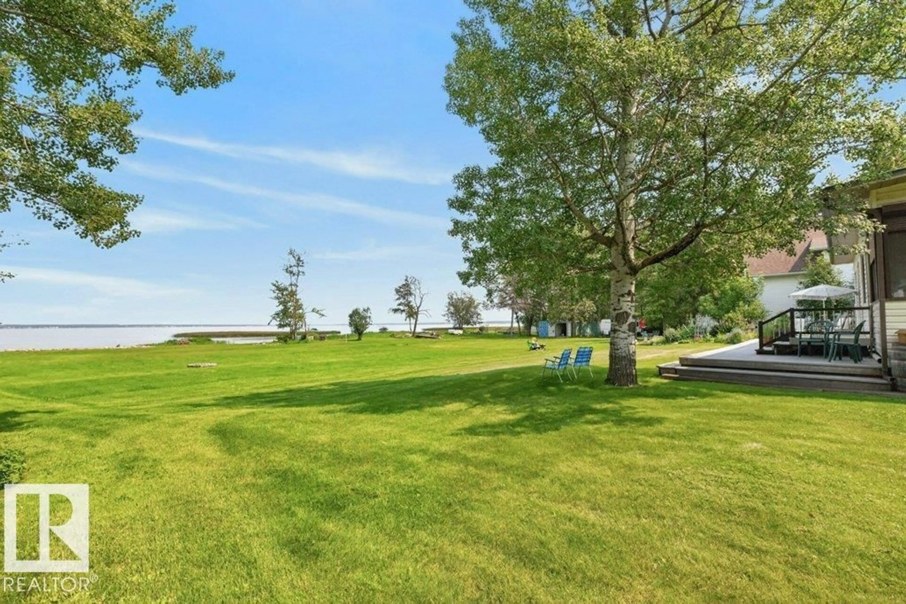 A pic from outside/outdoor area/front of a property/back of a property/a pic from drone, water/lake/river/ocean view for 506 - 54411 RGE ROAD 40, Rural Lac Ste. Anne County Alberta T0E2E0