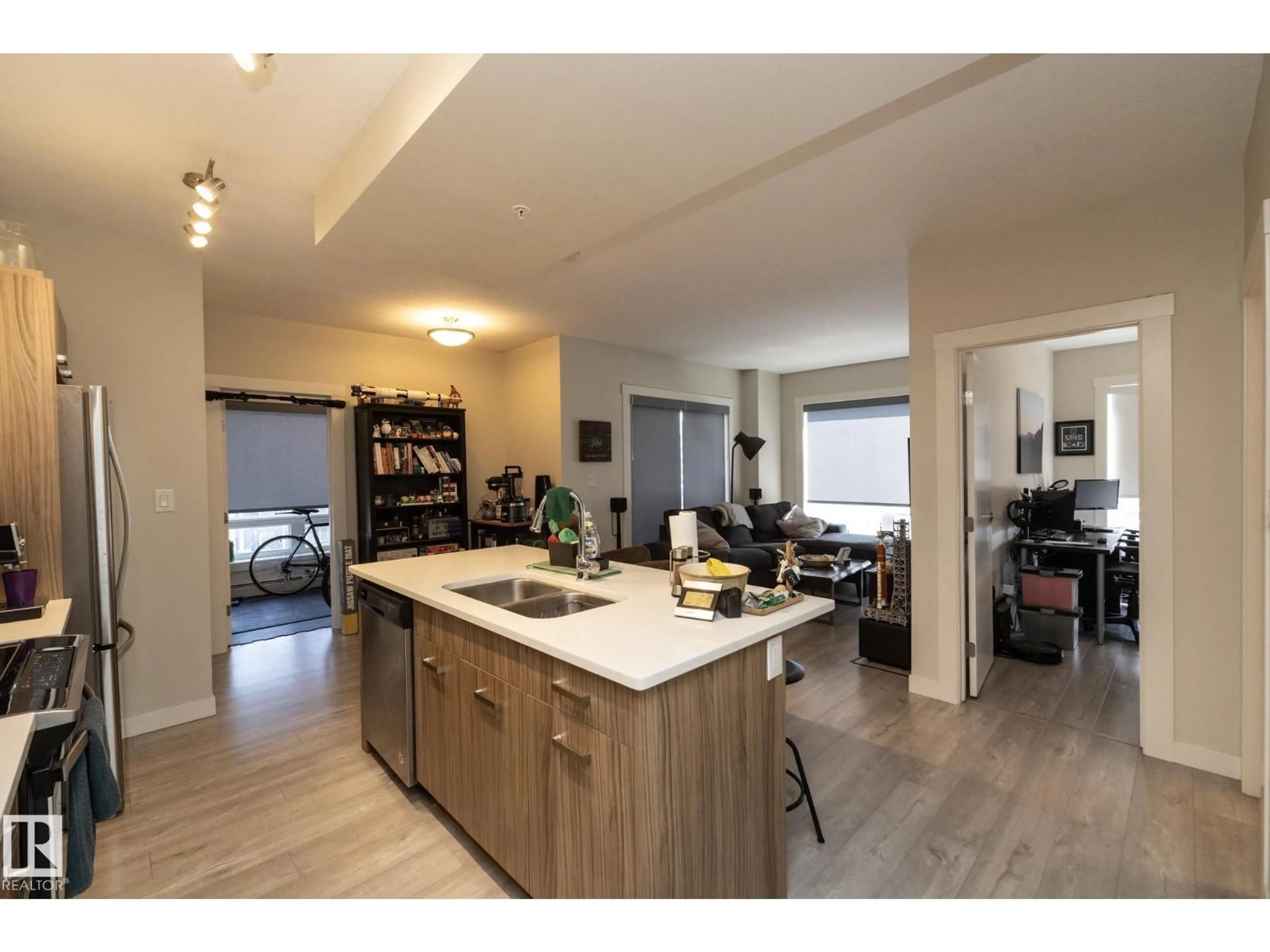 Open concept kitchen, wood/laminate floor for 2402 10410 102 AV NW, Edmonton Alberta T5J0E9