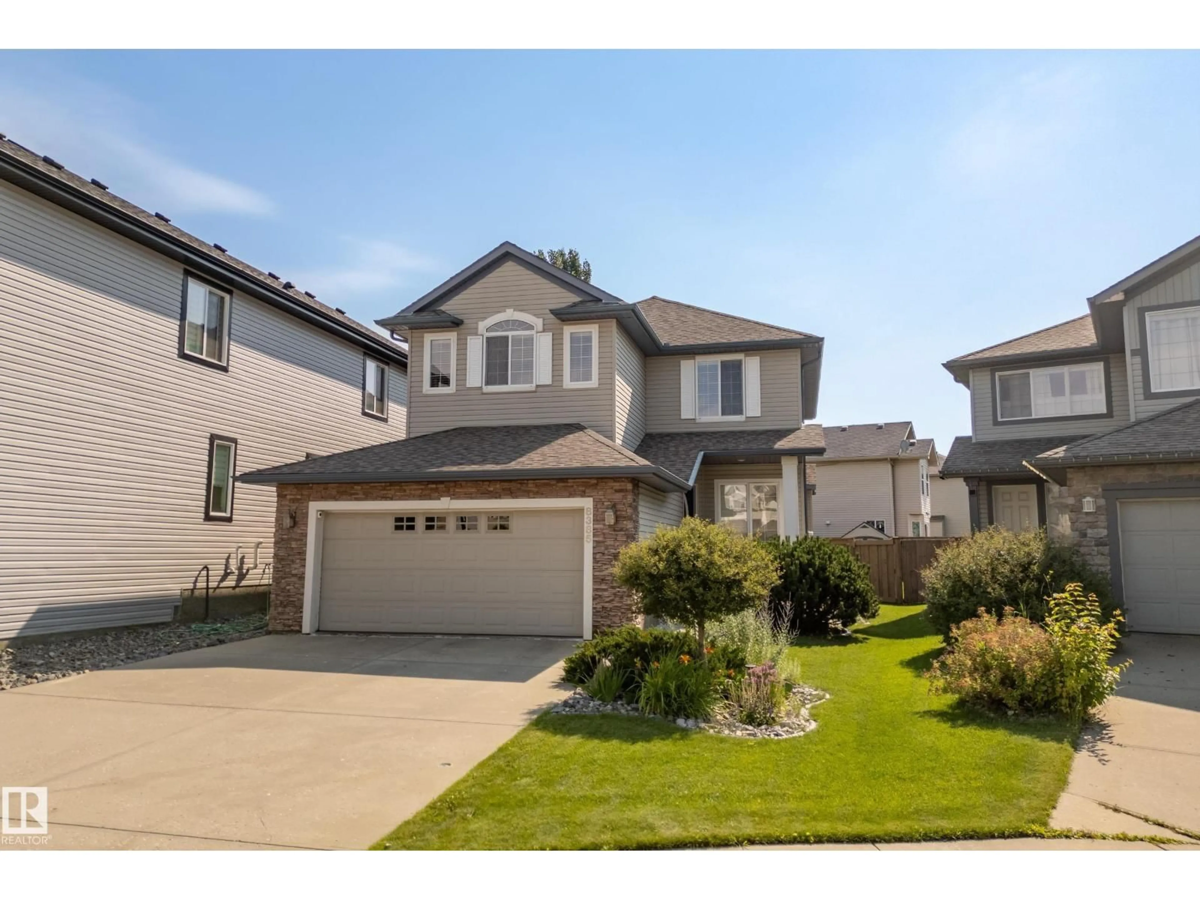 Home with vinyl exterior material, street for 8385 SHASKE CR, Edmonton Alberta T6R0B4
