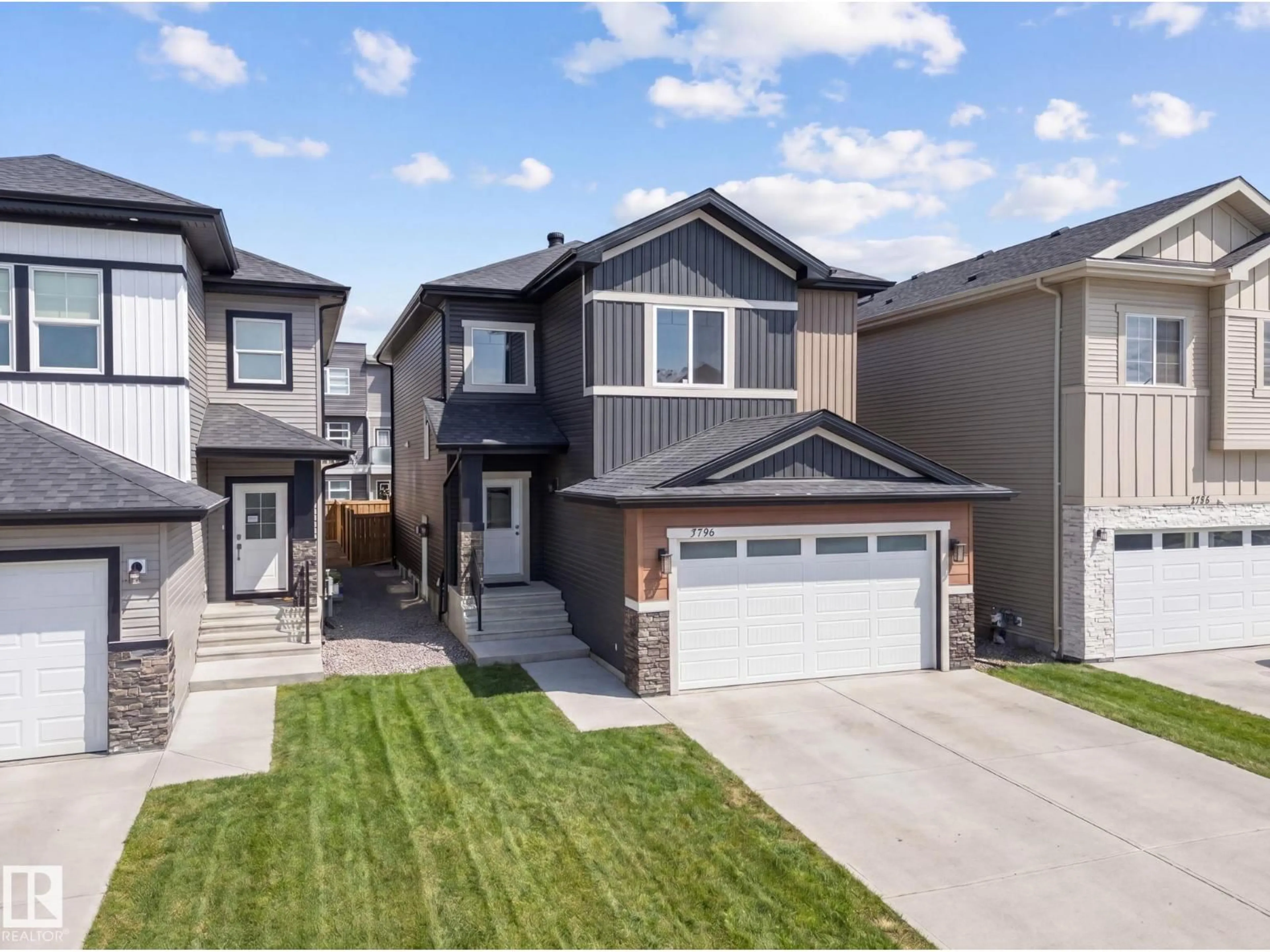 Home with vinyl exterior material, street for NW - 5736 176 AV, Edmonton Alberta T5Y0V2