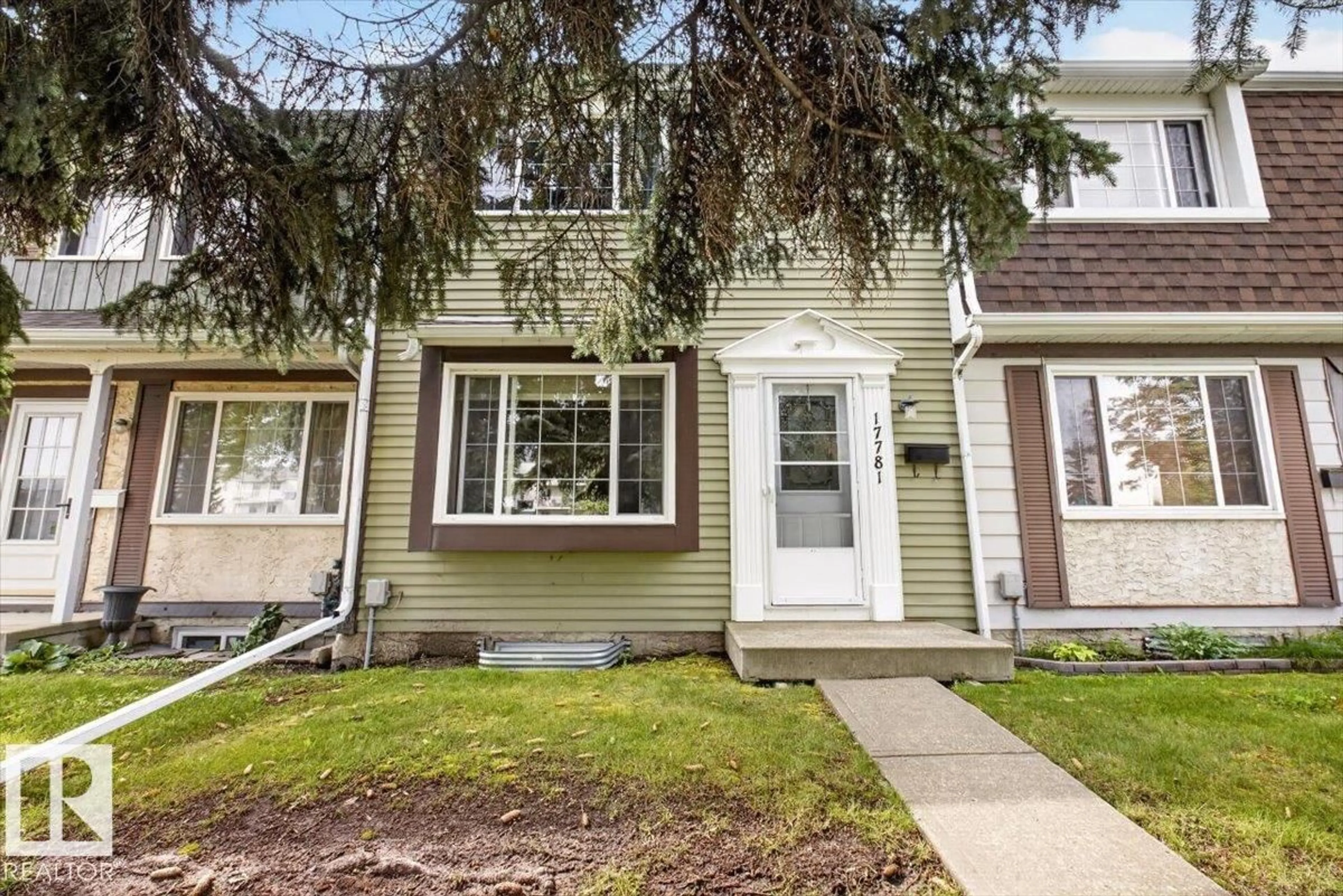 Home with vinyl exterior material, street for 17781 81 AV, Edmonton Alberta T5T1L4