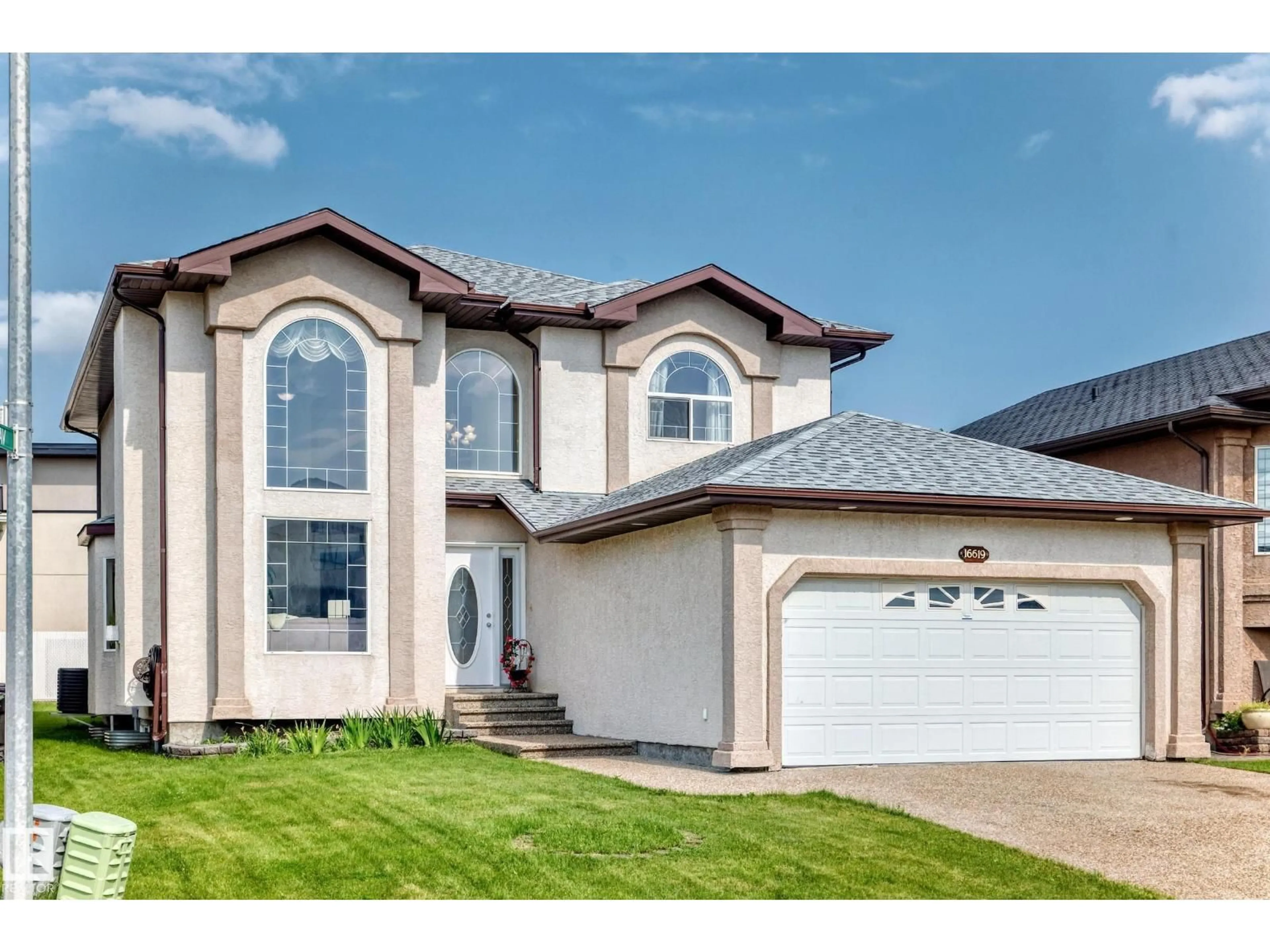 Home with vinyl exterior material, street for 16619 72 ST, Edmonton Alberta T5Z3Z7