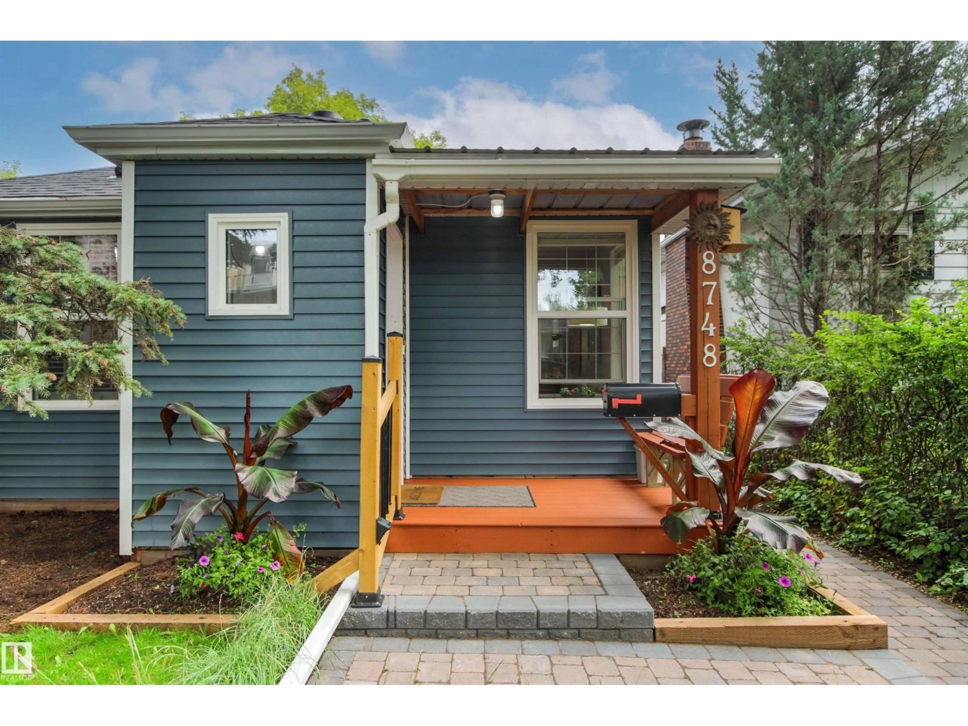Home with vinyl exterior material, street for 8748 80 AV, Edmonton Alberta T6C0T5