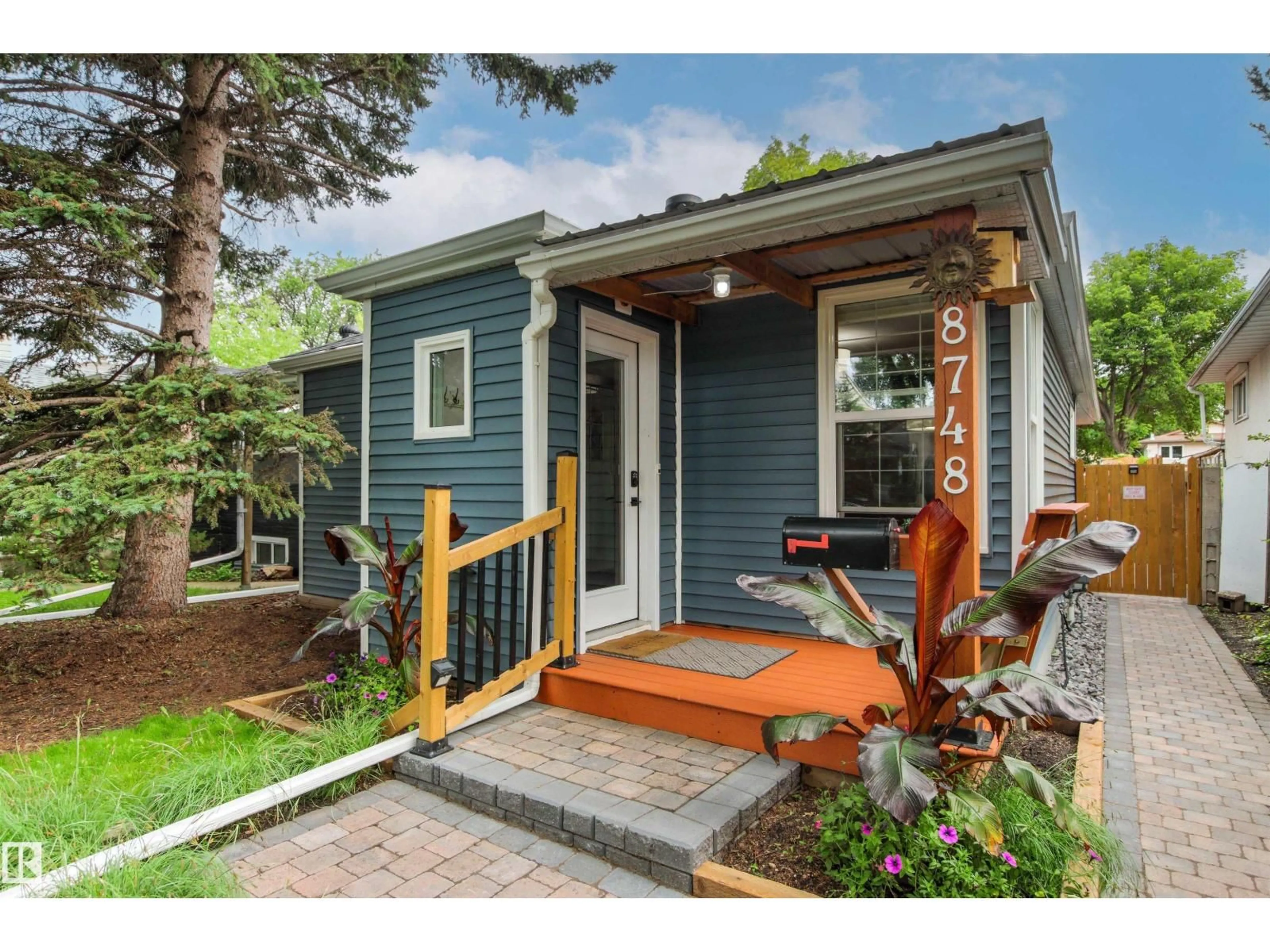 Home with vinyl exterior material, street for 8748 80 AV, Edmonton Alberta T6C0T5
