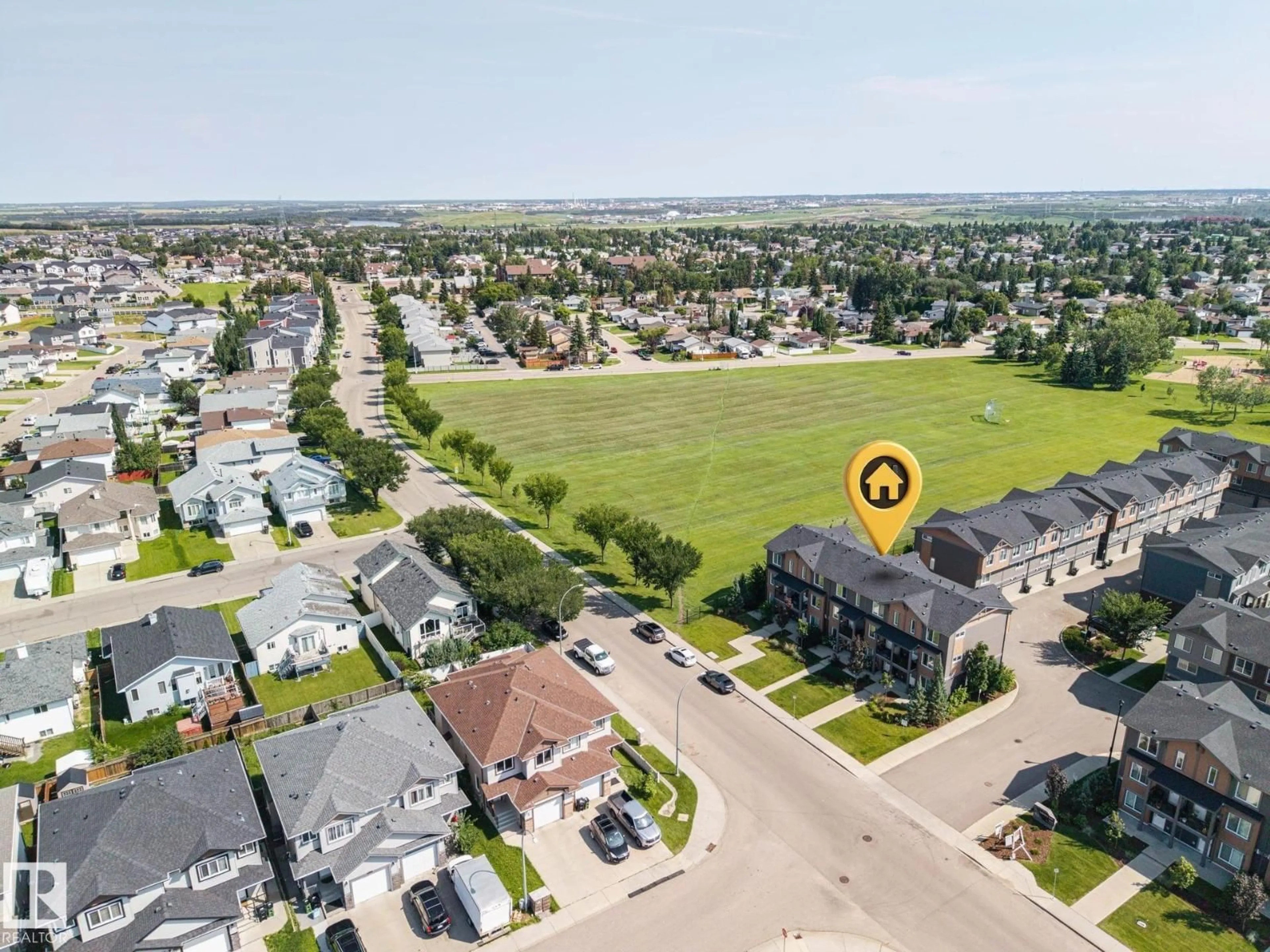 A pic from outside/outdoor area/front of a property/back of a property/a pic from drone, street for 3019 151 AV, Edmonton Alberta T5Y3W4