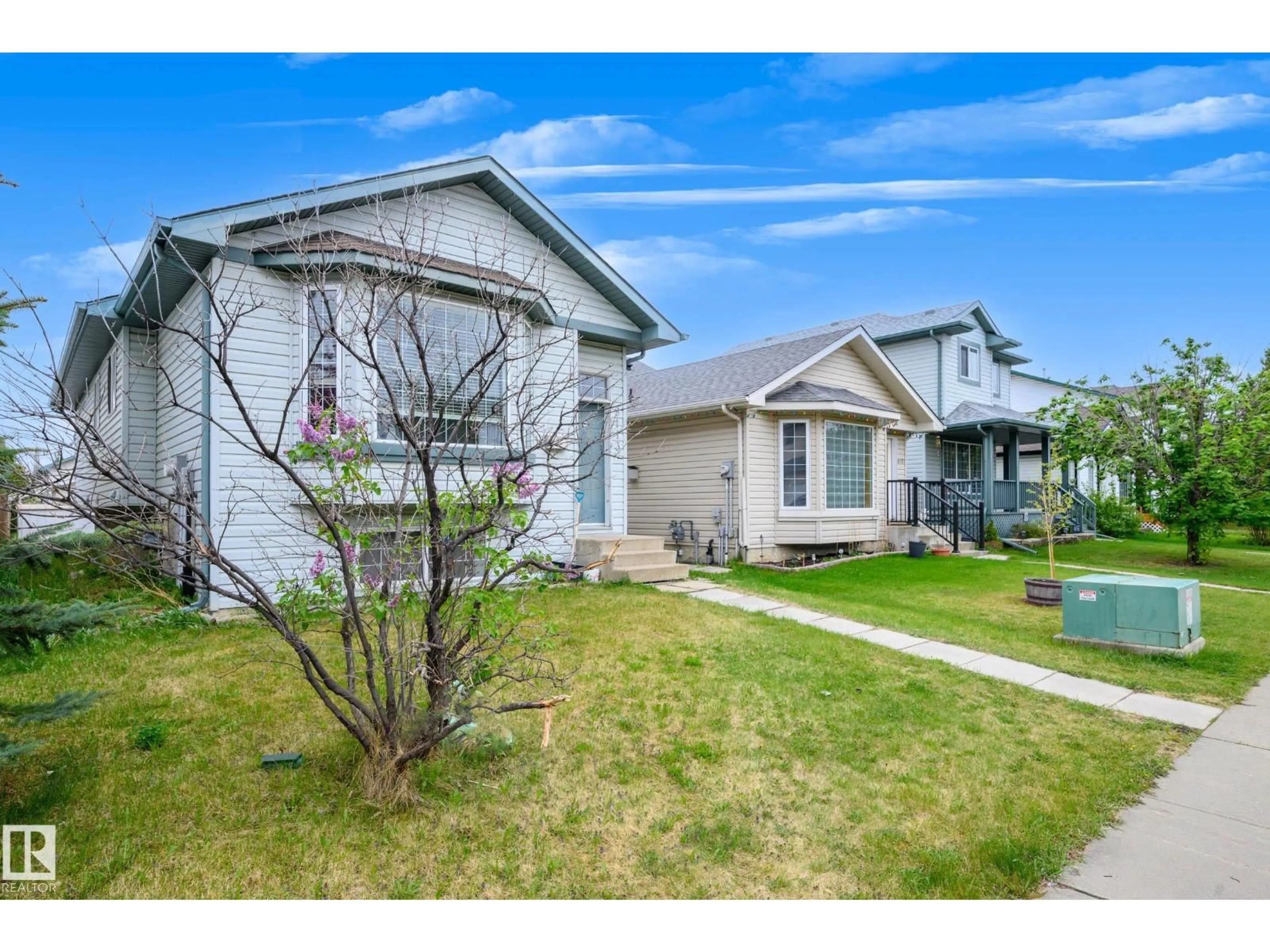 Home with vinyl exterior material, street for 9113 166 AV, Edmonton Alberta T5Z3H5