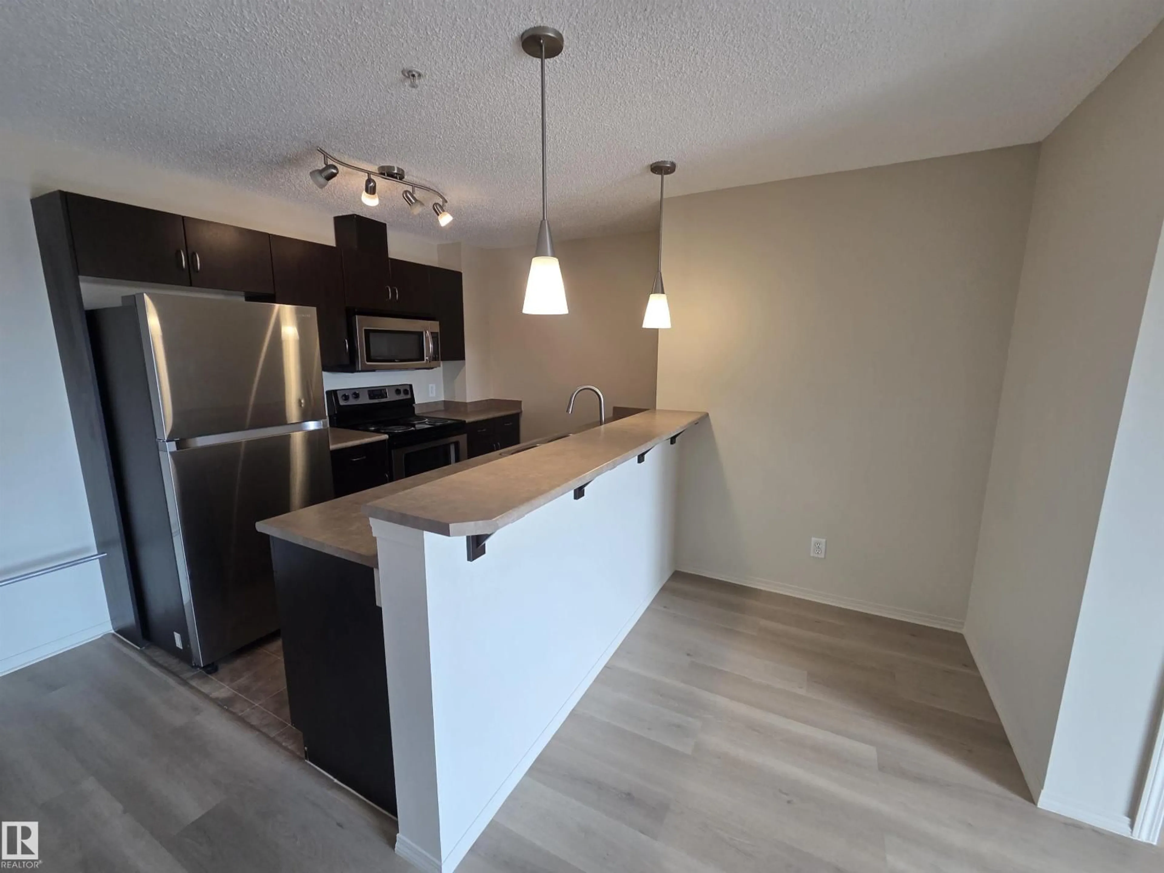 Open concept kitchen, unknown for #223 - 1180 HYNDMAN RD, Edmonton Alberta T5A0P8