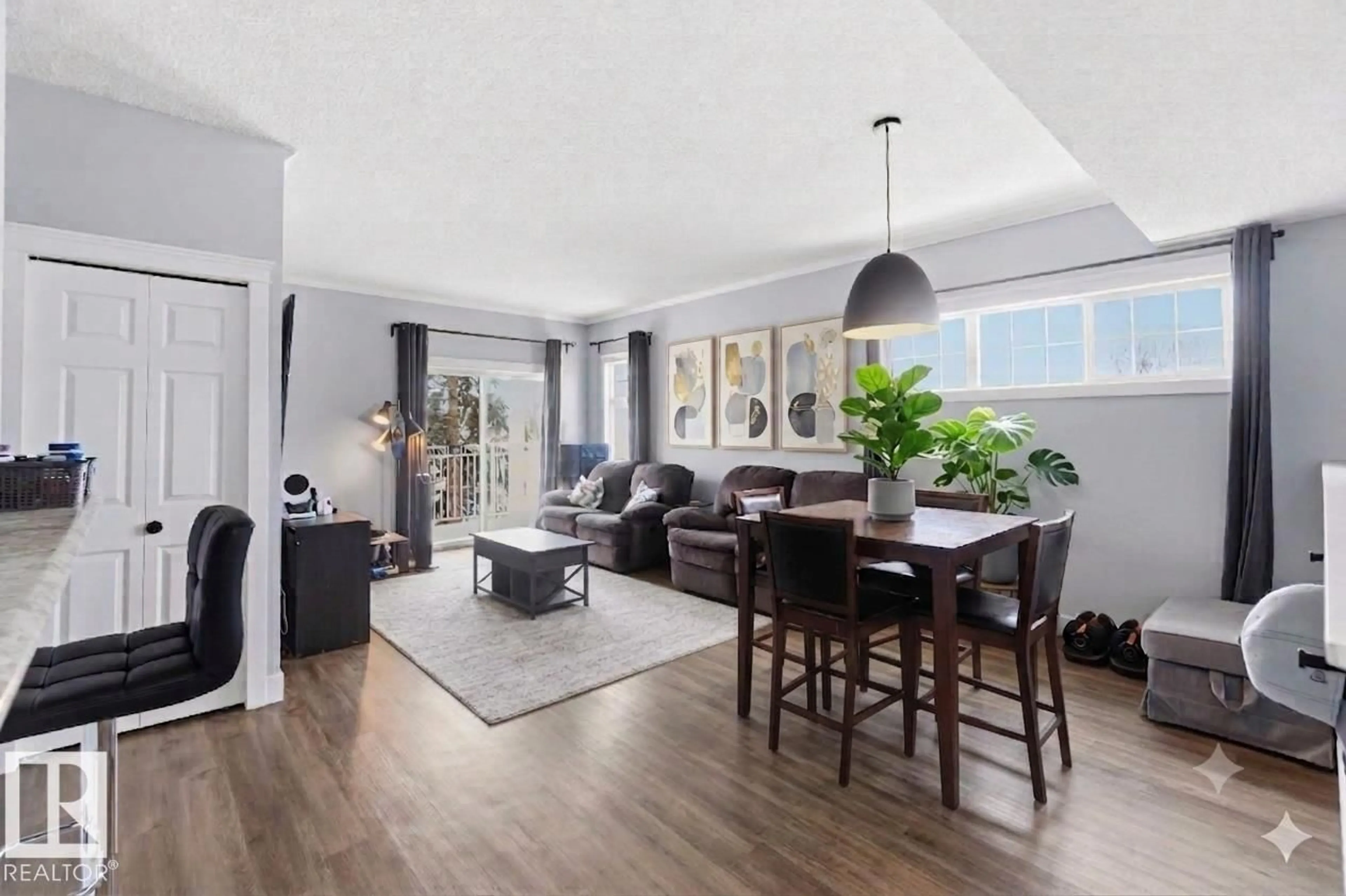 Living room with furniture, wood/laminate floor for #11 - 1179 SUMMERSIDE DR, Edmonton Alberta T6X1K1