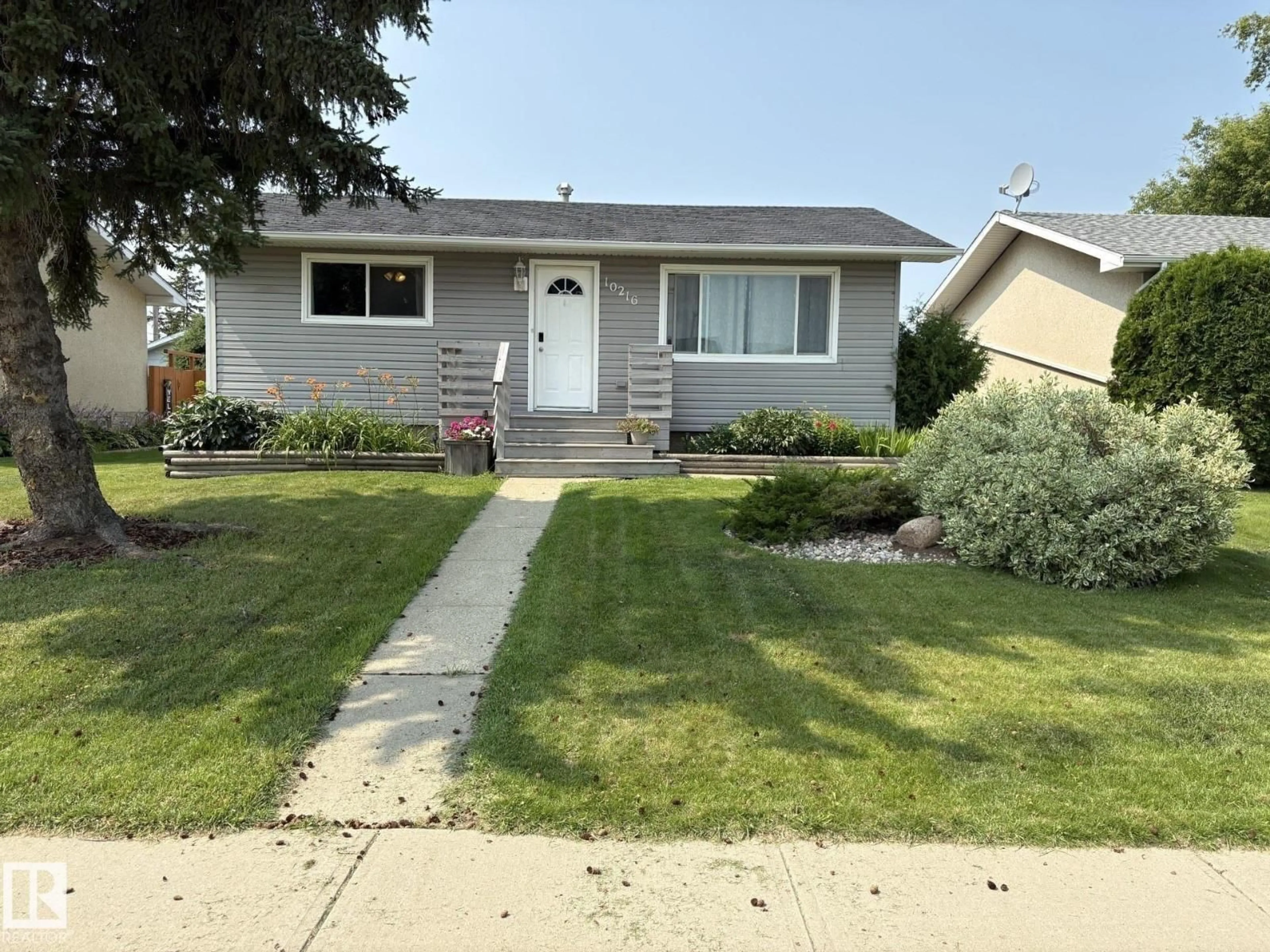 Home with vinyl exterior material, street for 10216 108 AV, Westlock Alberta T7P1J1