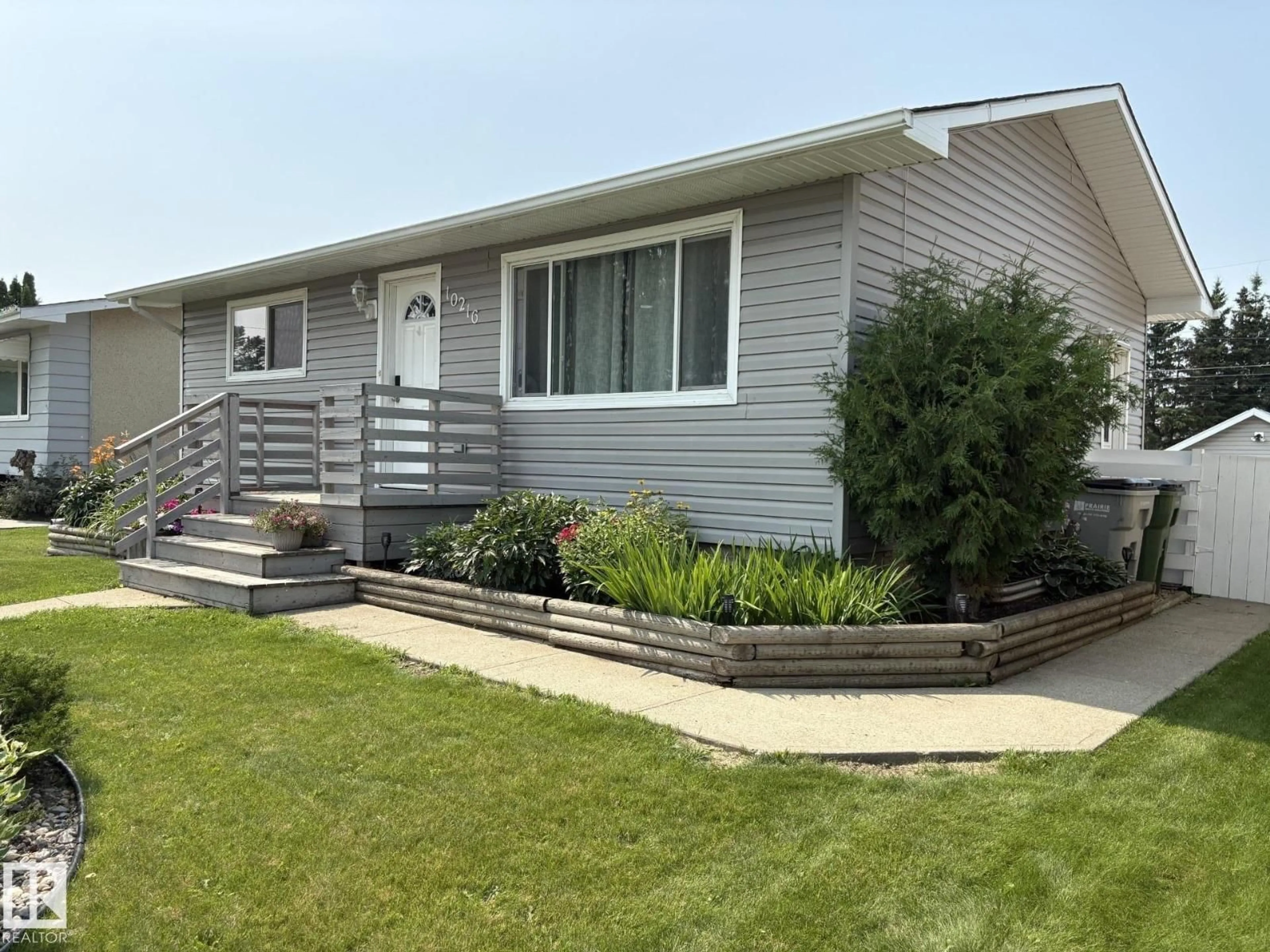 Home with vinyl exterior material, street for 10216 108 AV, Westlock Alberta T7P1J1