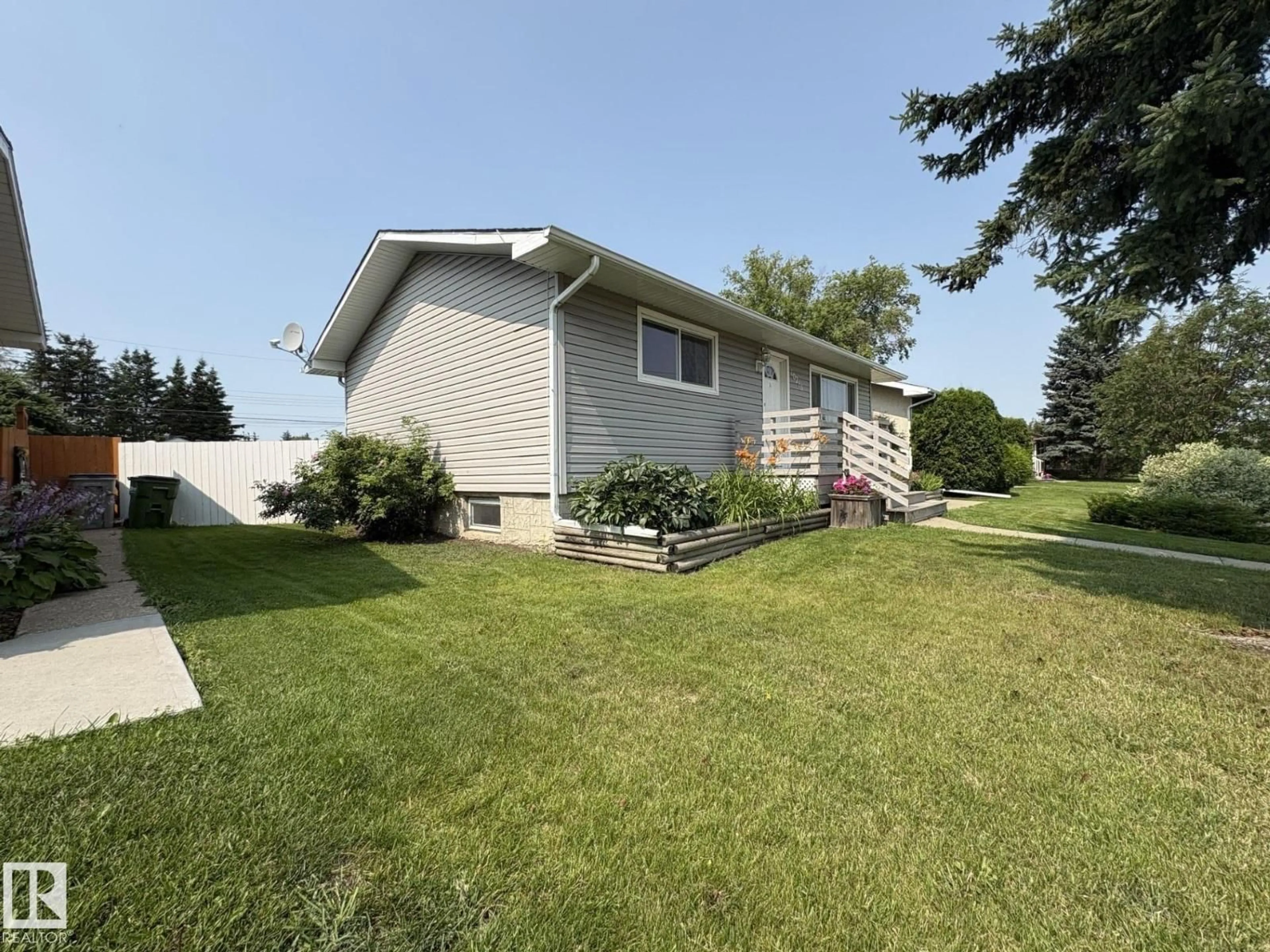 Home with vinyl exterior material, street for 10216 108 AV, Westlock Alberta T7P1J1