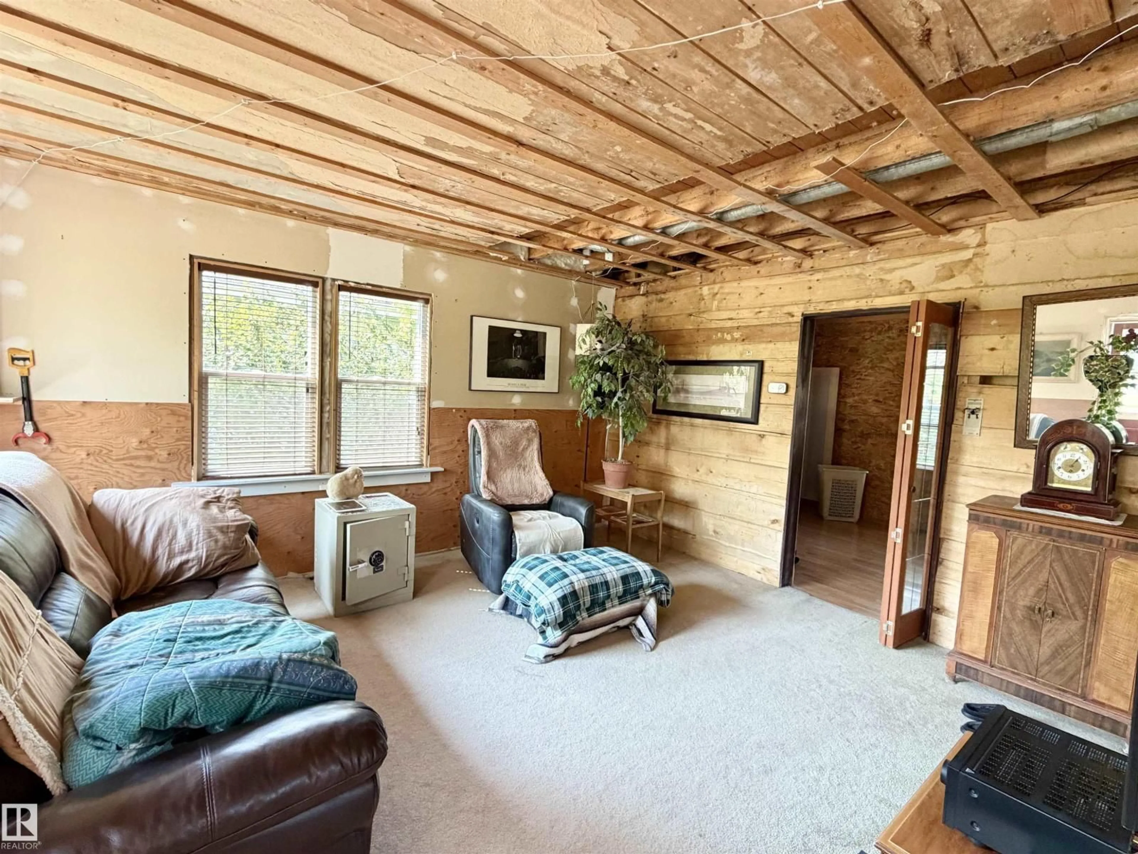 Living room with furniture, wood/laminate floor for 5040 49 ST, Drayton Valley Alberta T7A1C9