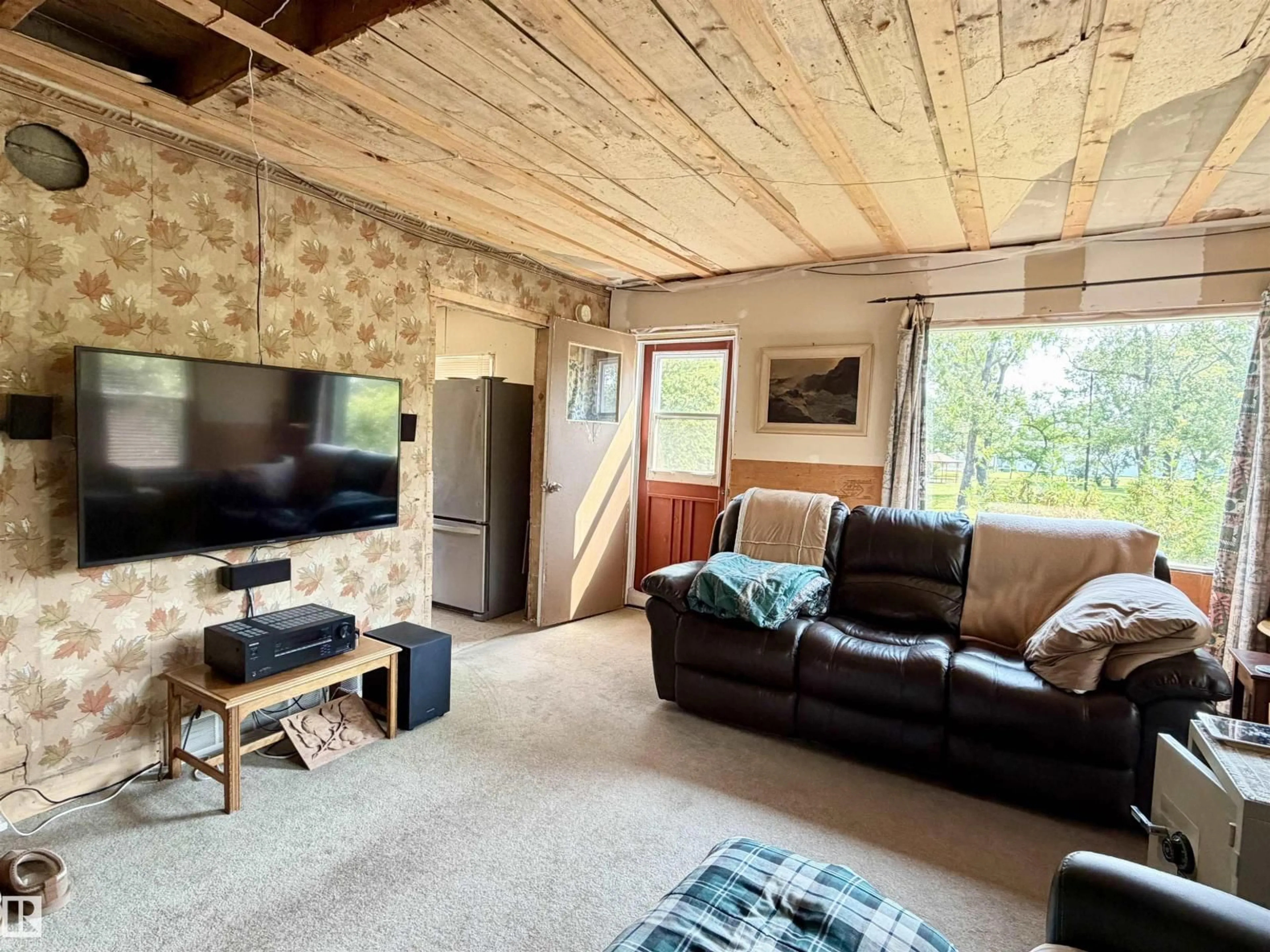 Living room with furniture, wood/laminate floor for 5040 49 ST, Drayton Valley Alberta T7A1C9