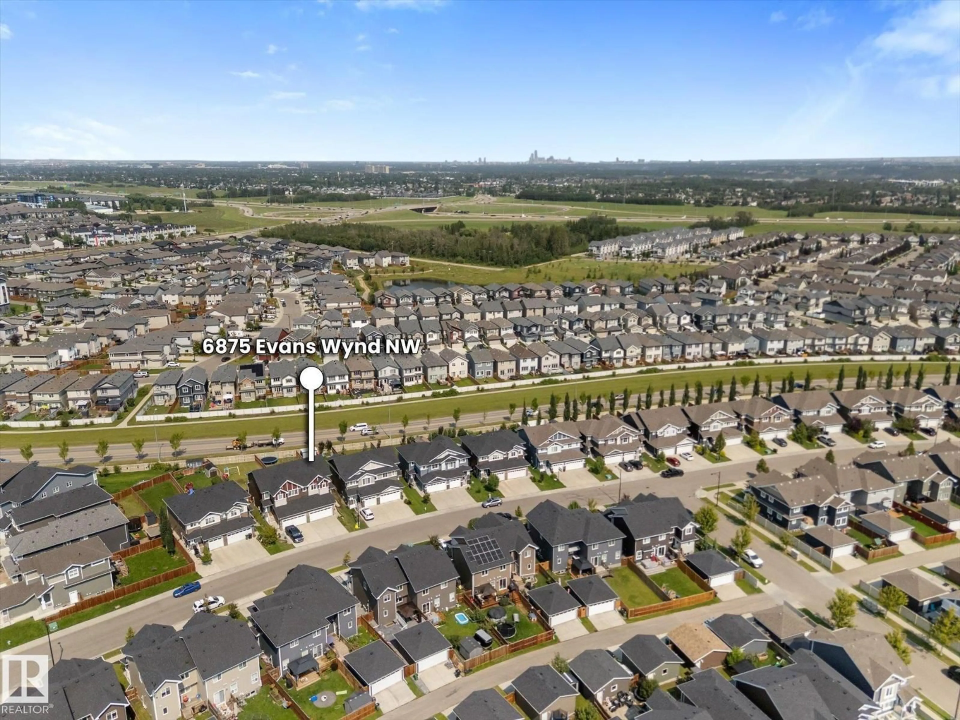 A pic from outside/outdoor area/front of a property/back of a property/a pic from drone, street for 6875 EVANS WD, Edmonton Alberta T6M0T6