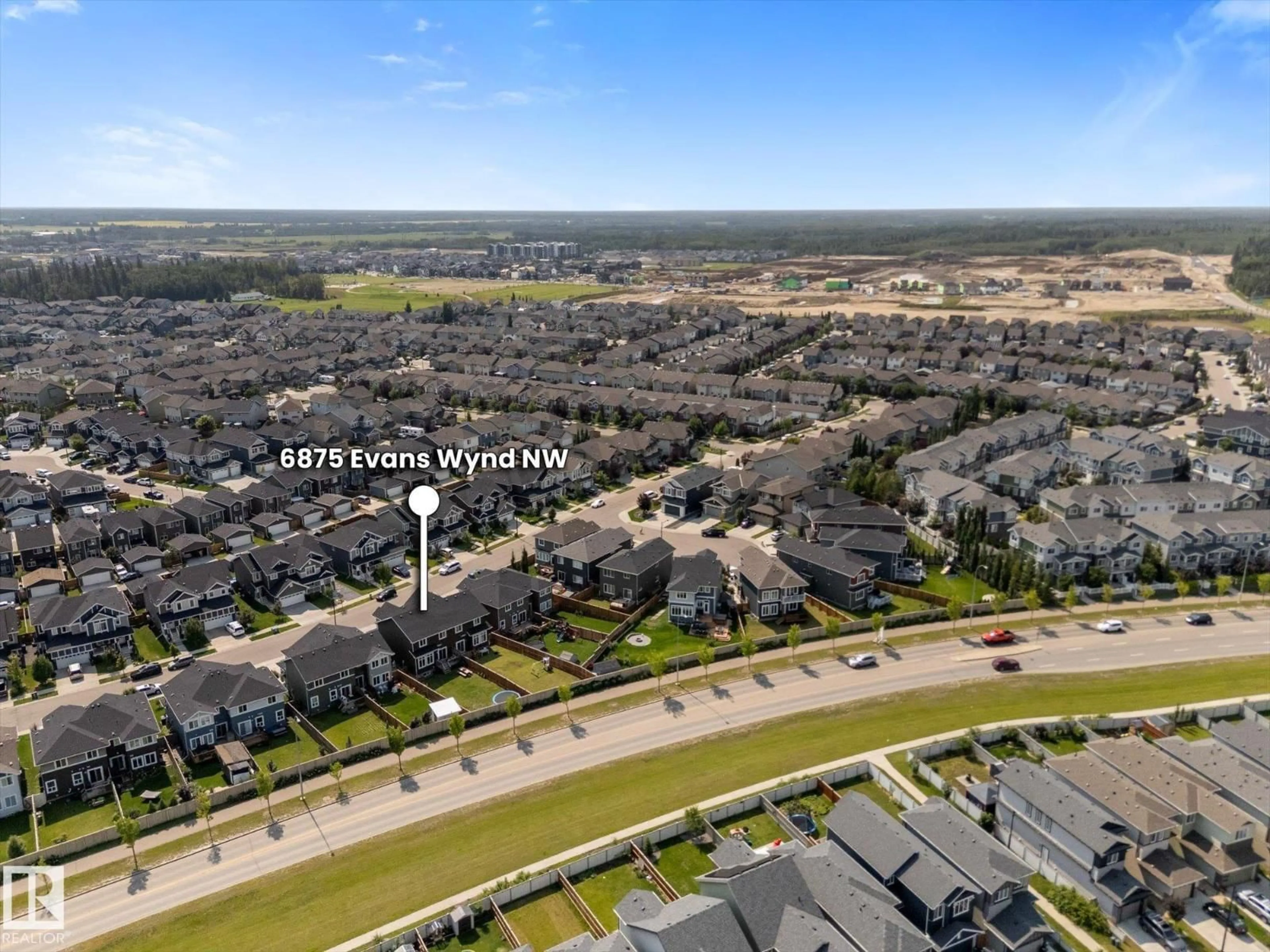 A pic from outside/outdoor area/front of a property/back of a property/a pic from drone, street for 6875 EVANS WD, Edmonton Alberta T6M0T6