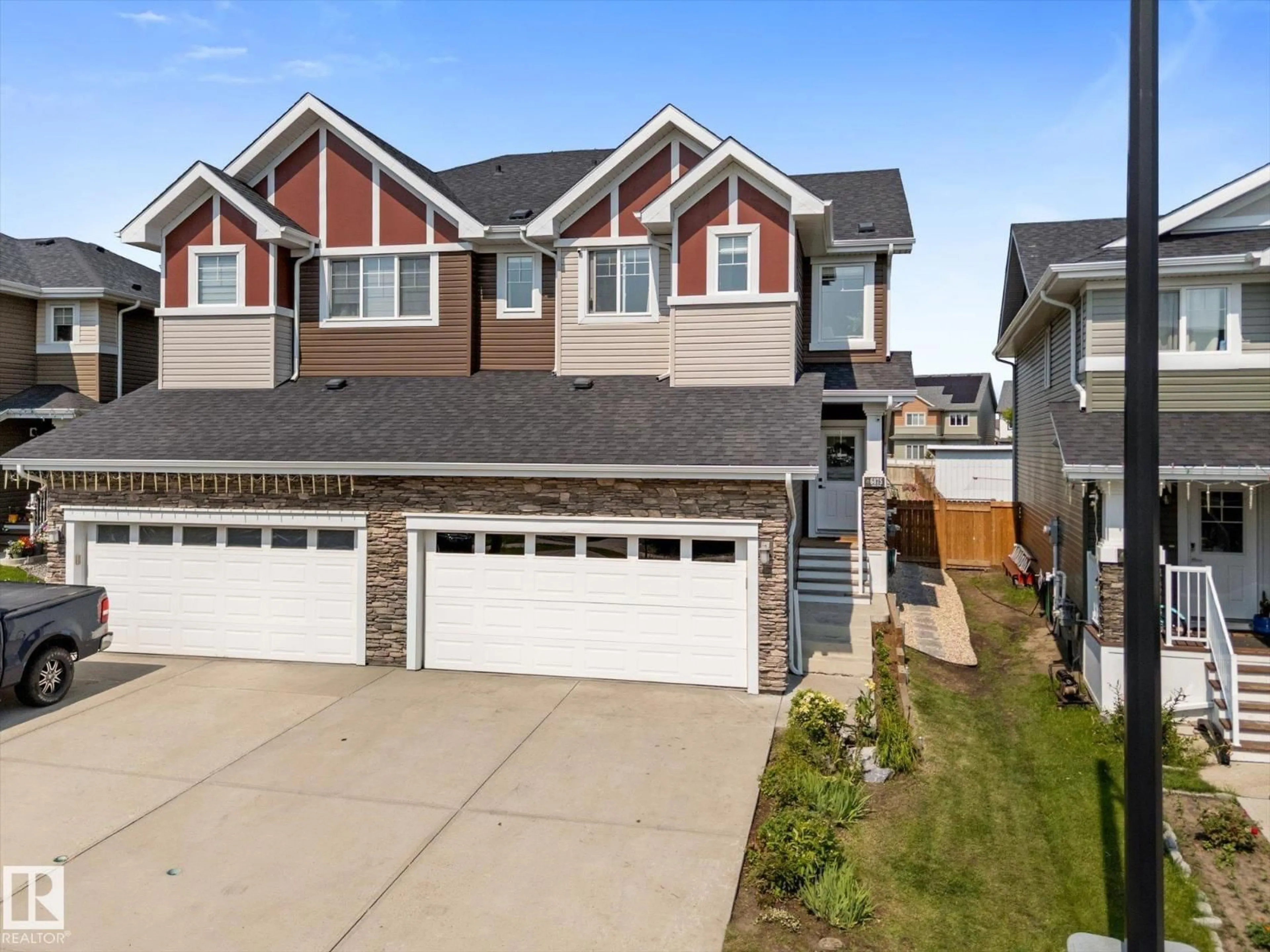 Home with vinyl exterior material, street for 6875 EVANS WD, Edmonton Alberta T6M0T6