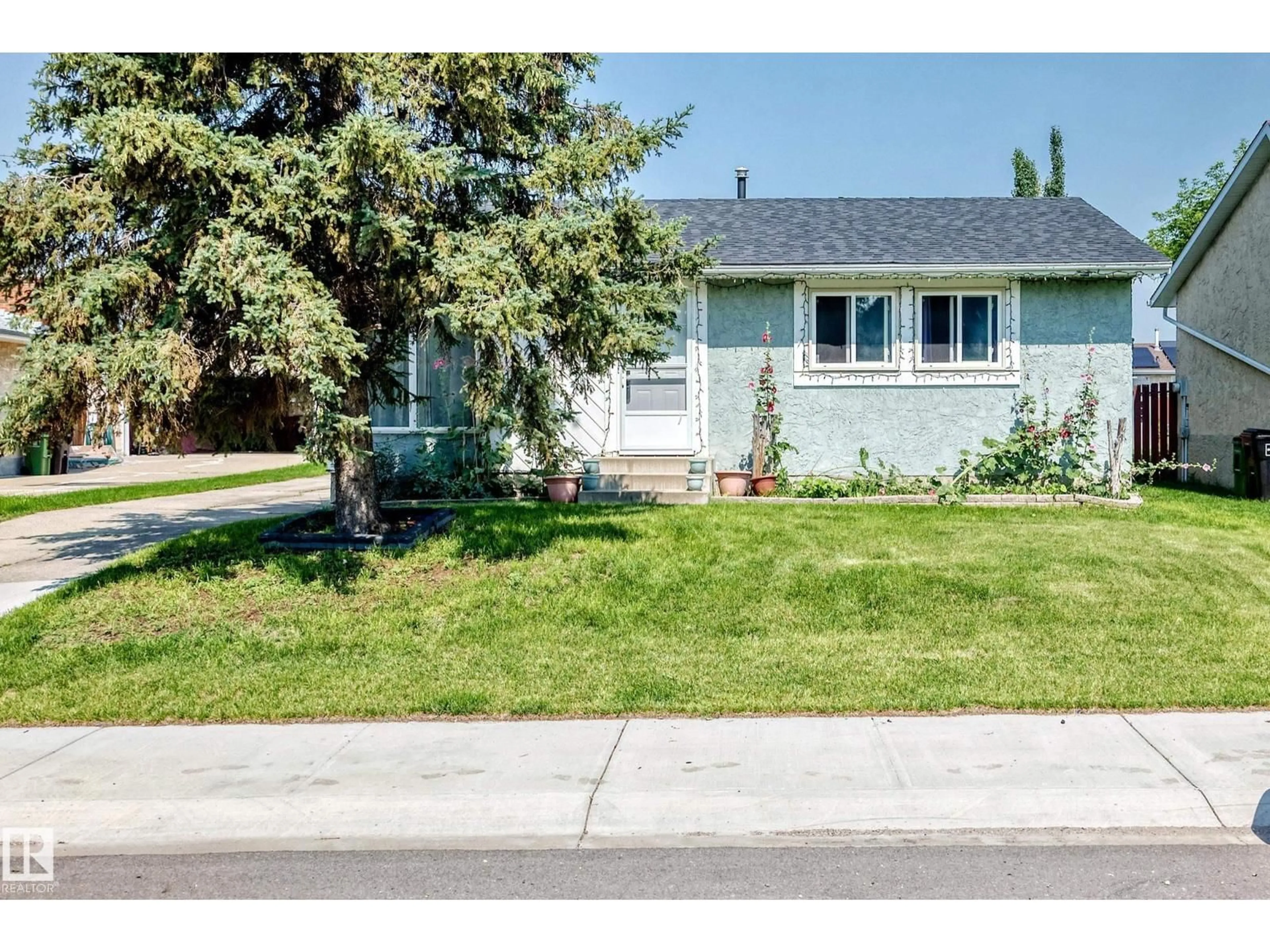 Home with vinyl exterior material, street for 9824 171 AV, Edmonton Alberta T5X3G4
