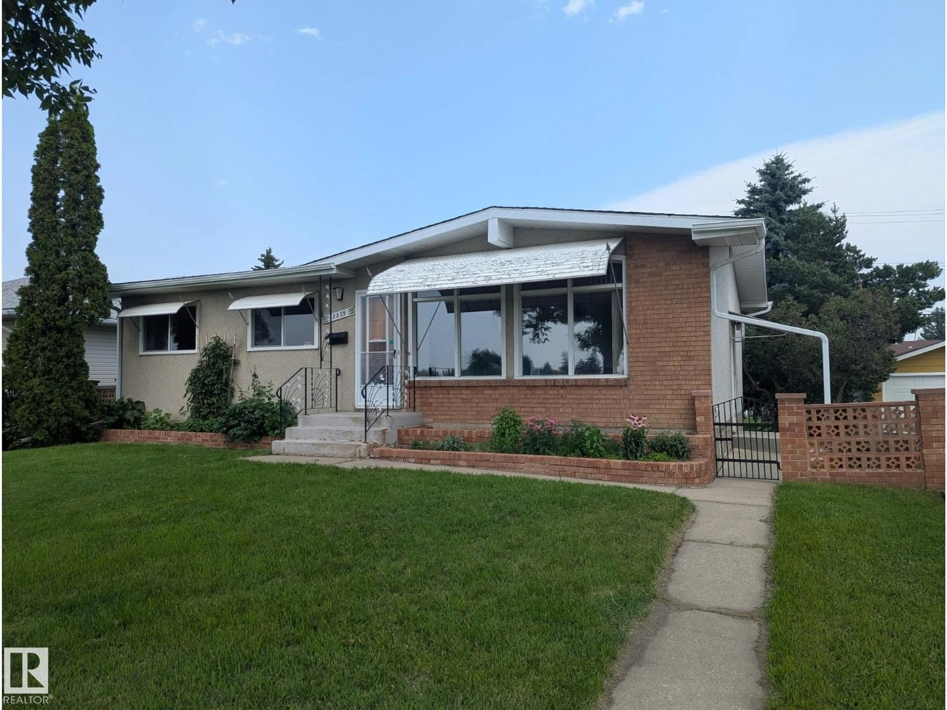 Home with vinyl exterior material, street for NW - 12835 91 ST, Edmonton Alberta T5E3P4
