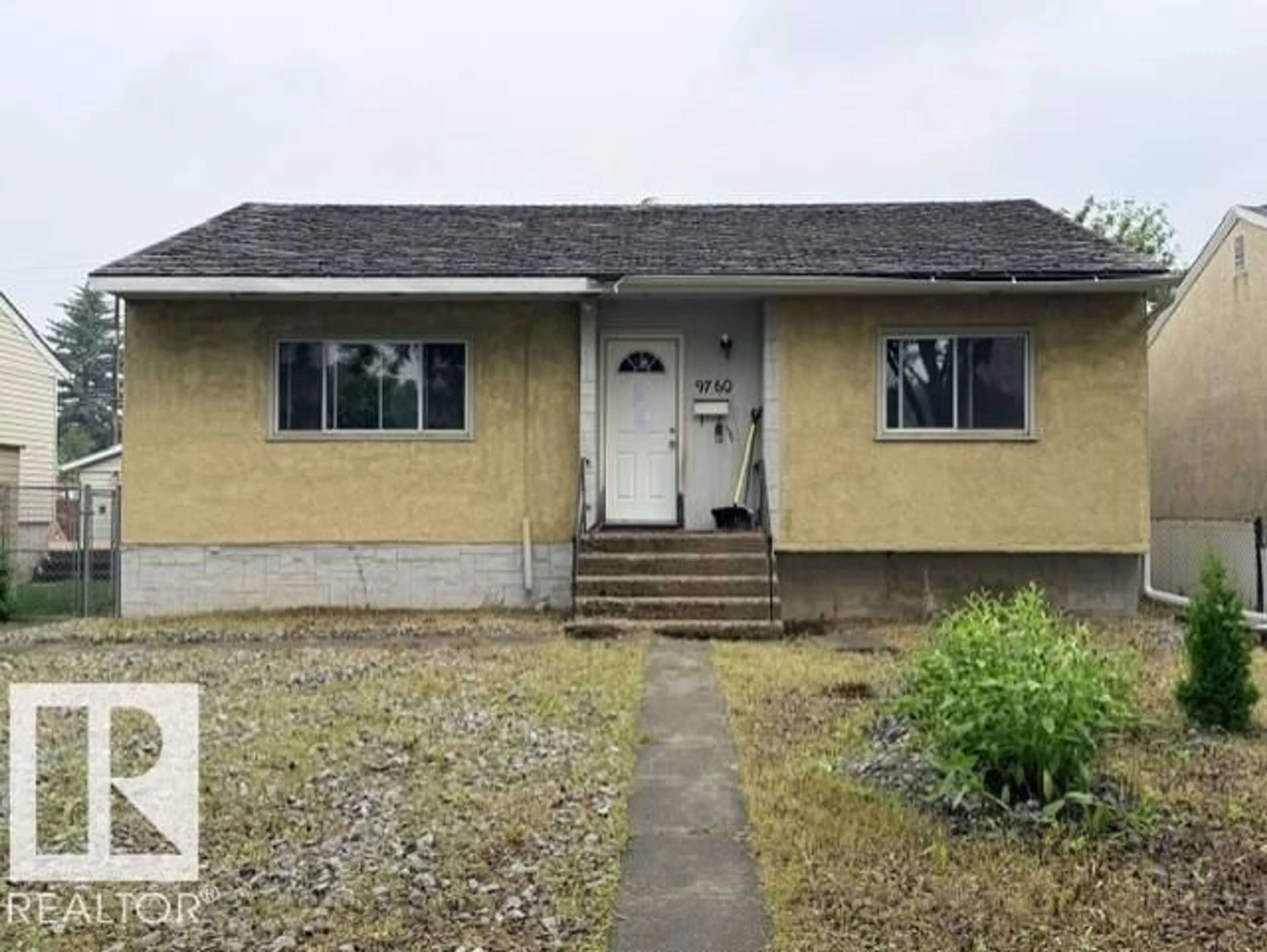Home with vinyl exterior material, street for NW - 9760 65 AV, Edmonton Alberta T6E0K6