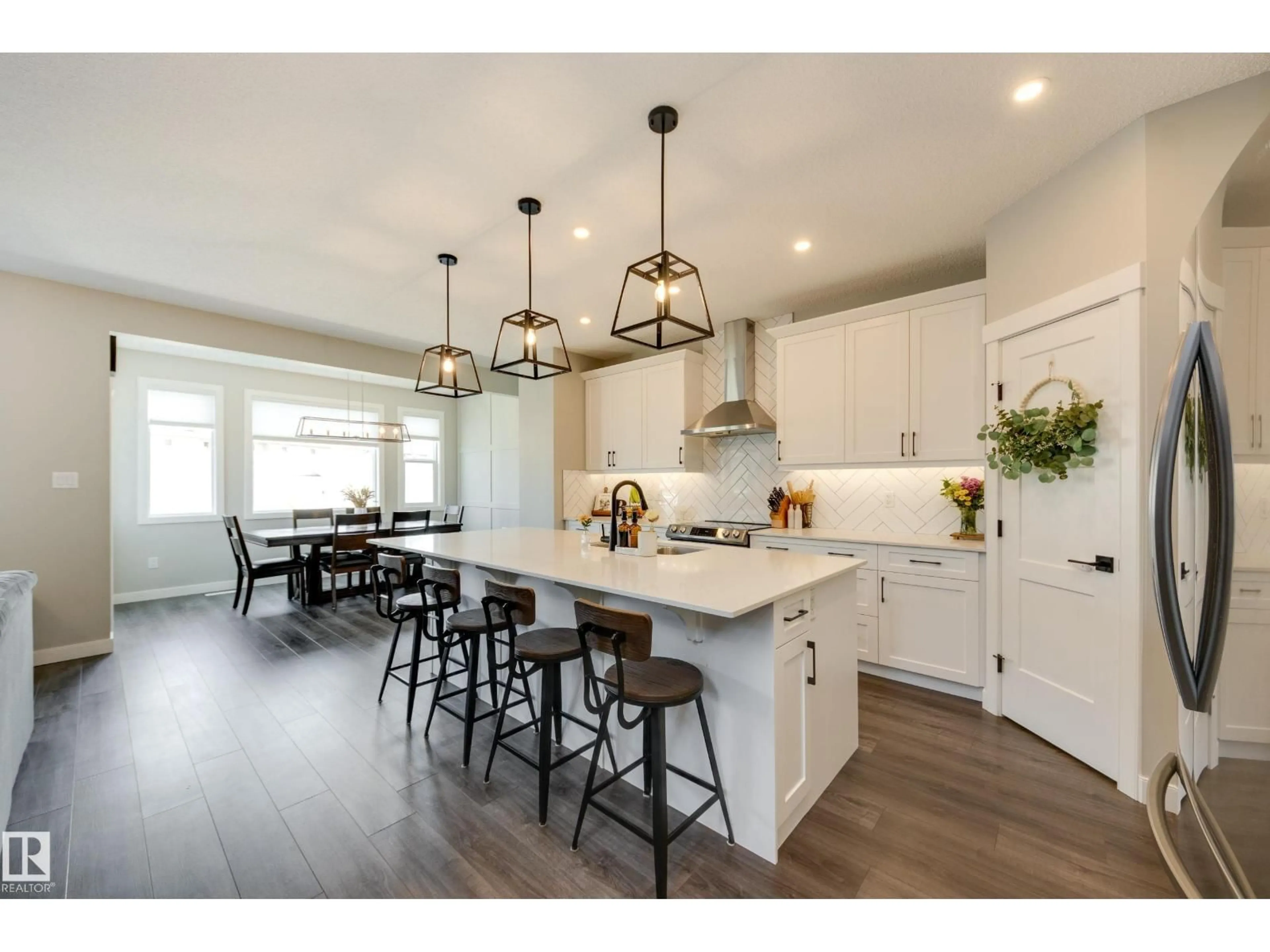 Open concept kitchen, wood/laminate floor for 25 DALY PL, Fort Saskatchewan Alberta T8L0X3