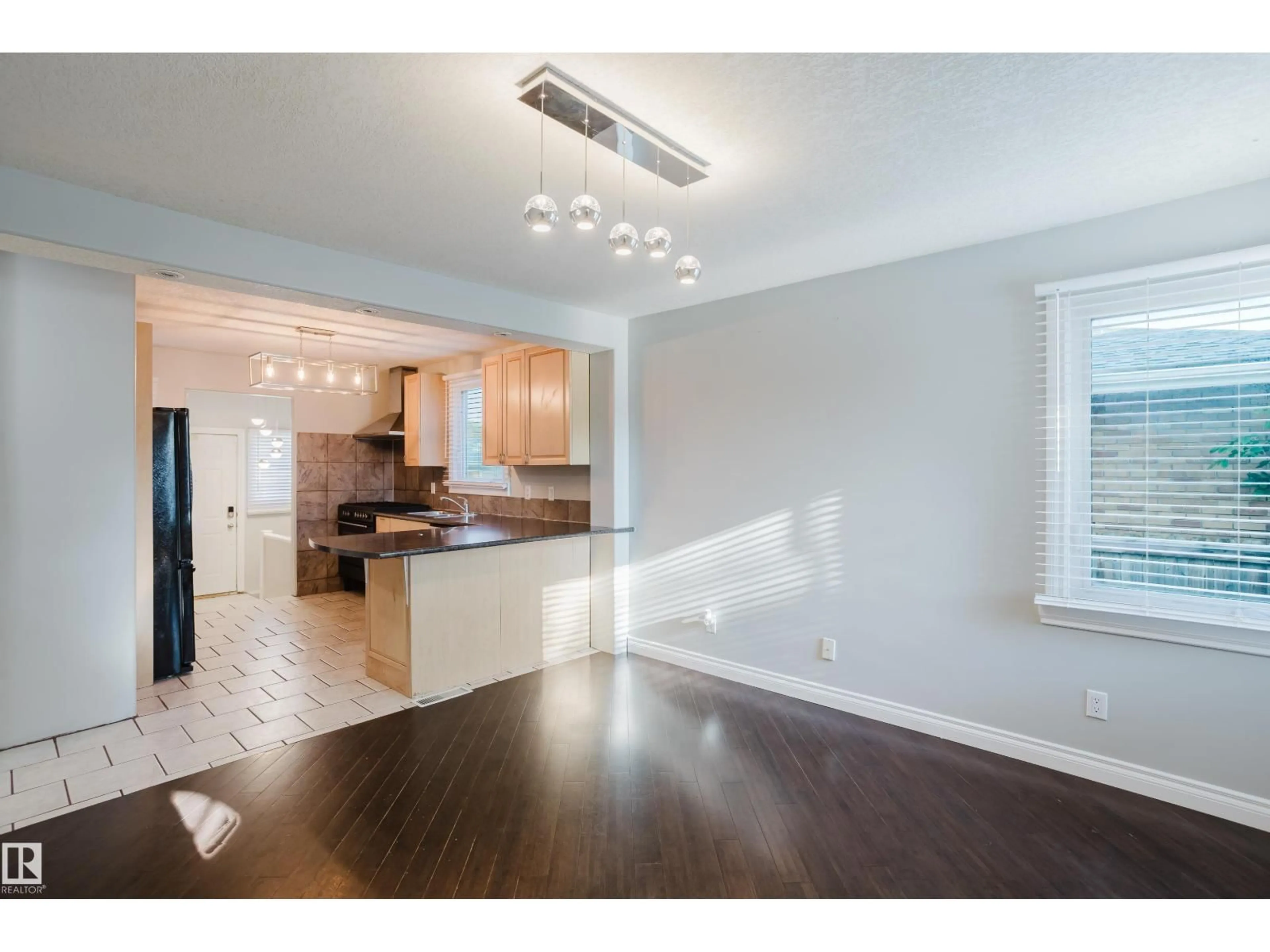 Open concept kitchen, wood/laminate floor for NW - 12431 81 ST, Edmonton Alberta T5B2T6