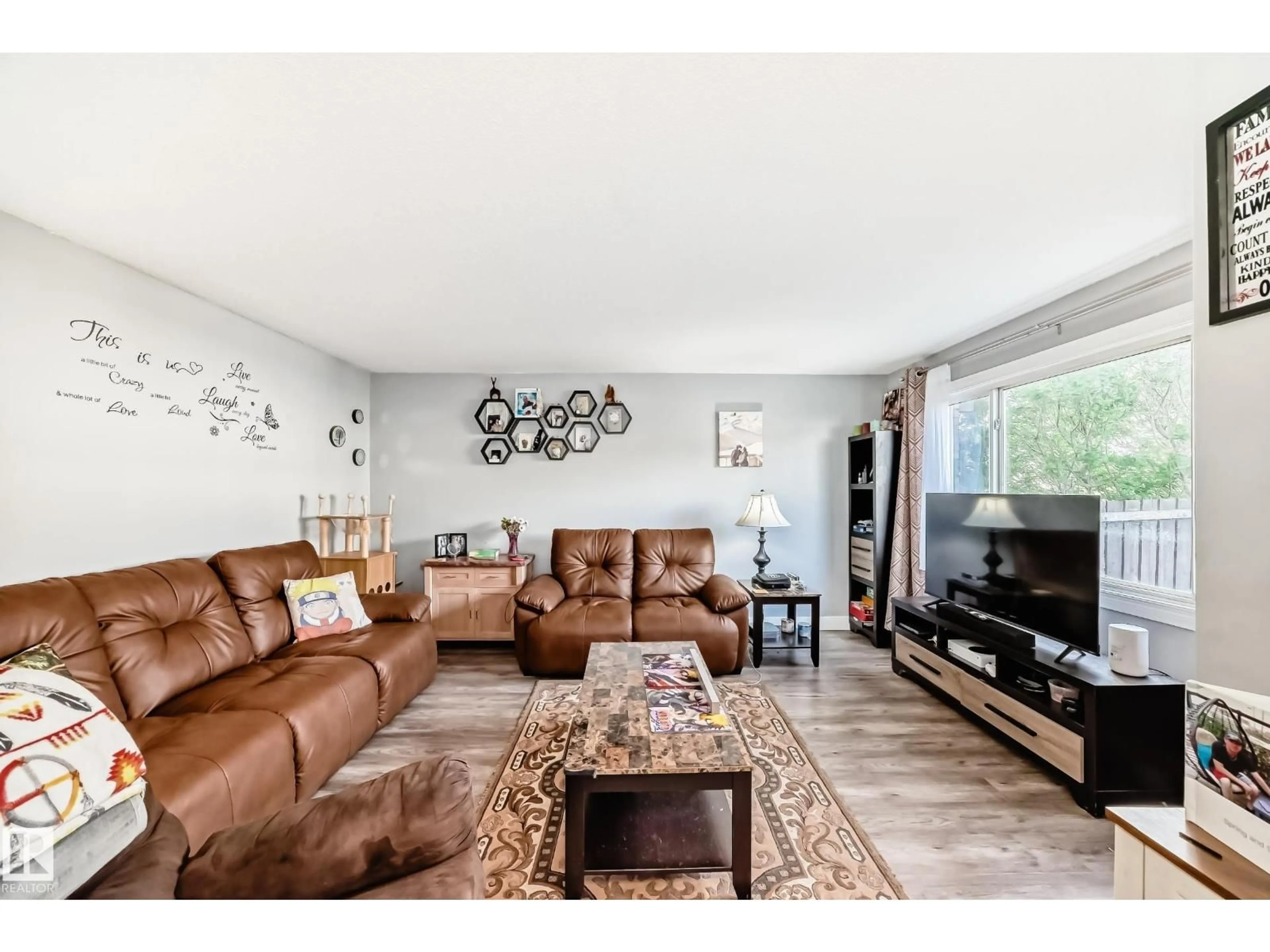 Living room with furniture, wood/laminate floor for NW - 167 ROSELAND VG, Edmonton Alberta T5E5R6