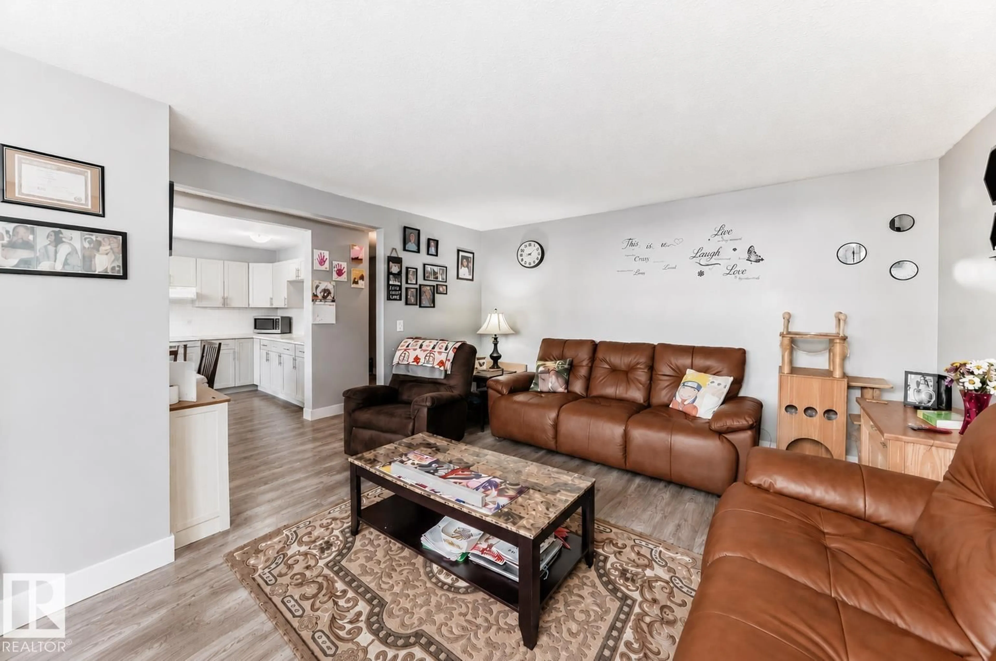 Living room with furniture, wood/laminate floor for NW - 167 ROSELAND VG, Edmonton Alberta T5E5R6
