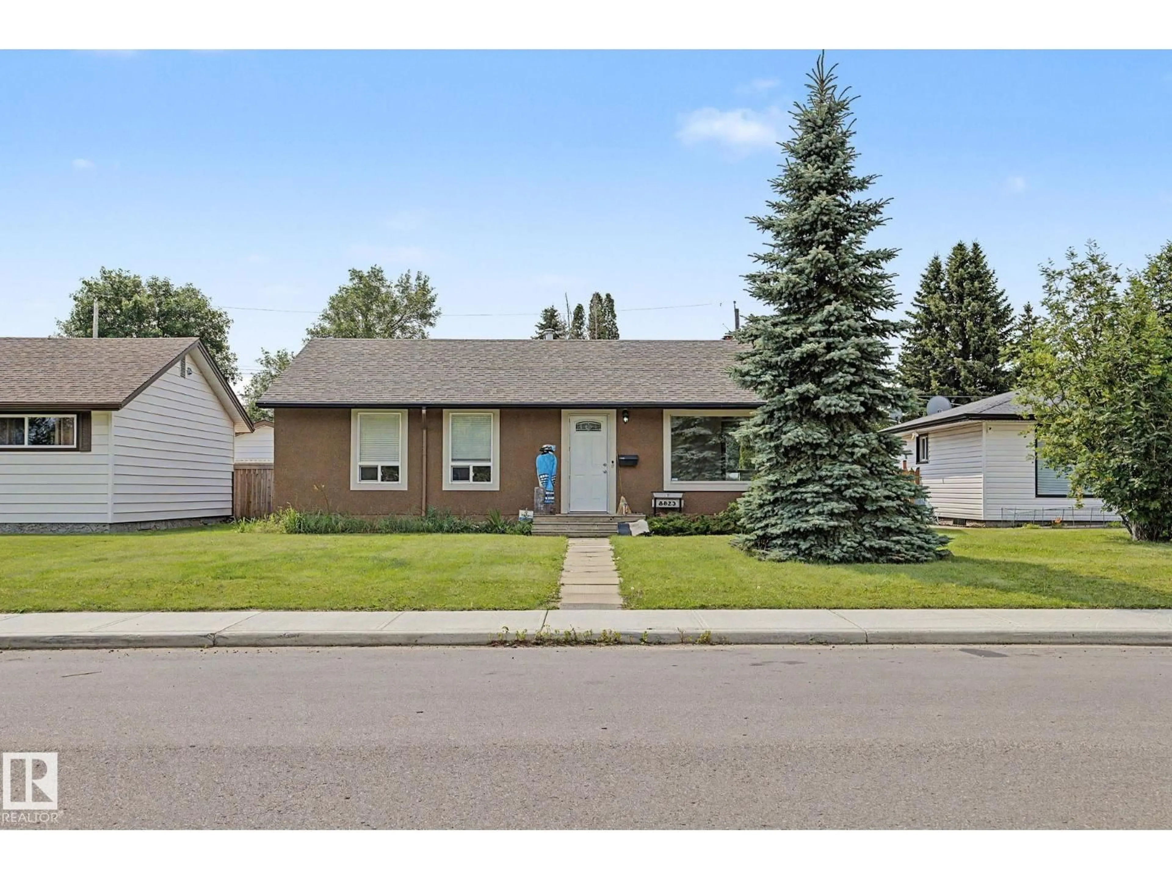 Home with vinyl exterior material, street for NW - 8823 130A AV, Edmonton Alberta T5E0V7
