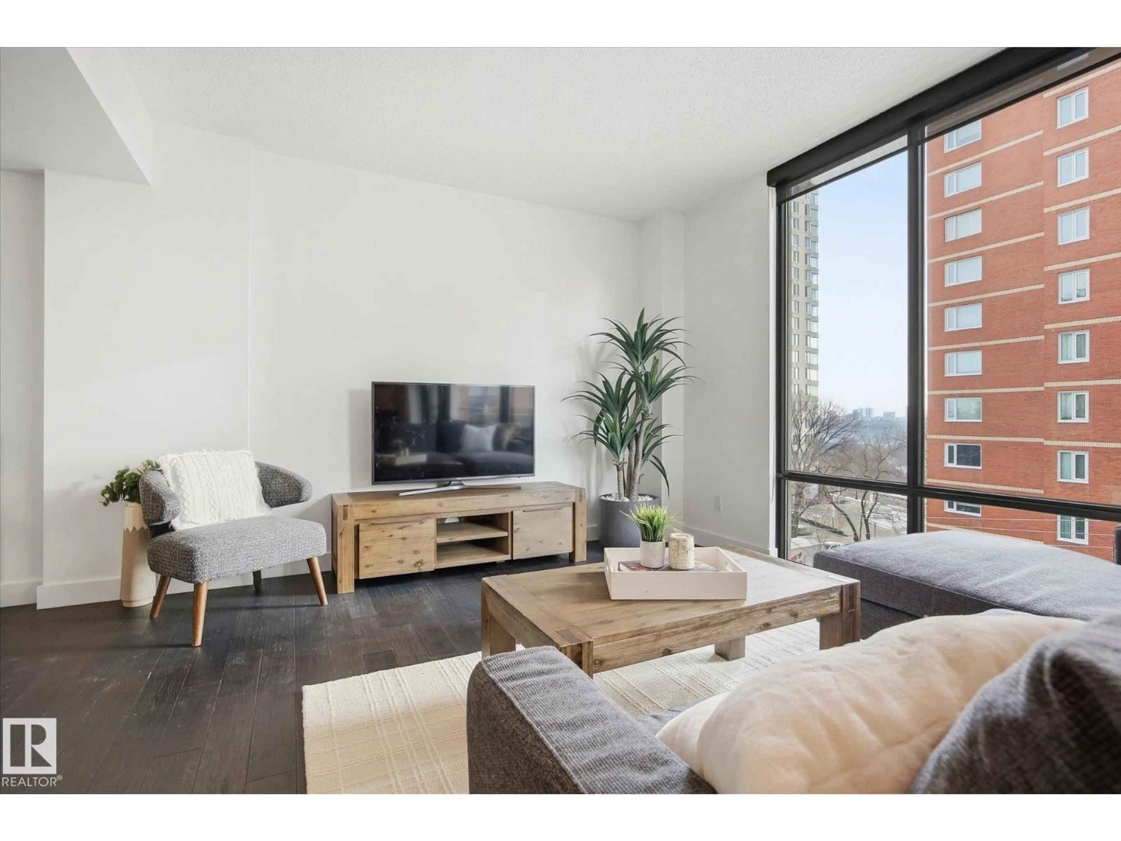 Living room with furniture, wood/laminate floor for 506 - 10028 119 ST, Edmonton Alberta T5K1Y8