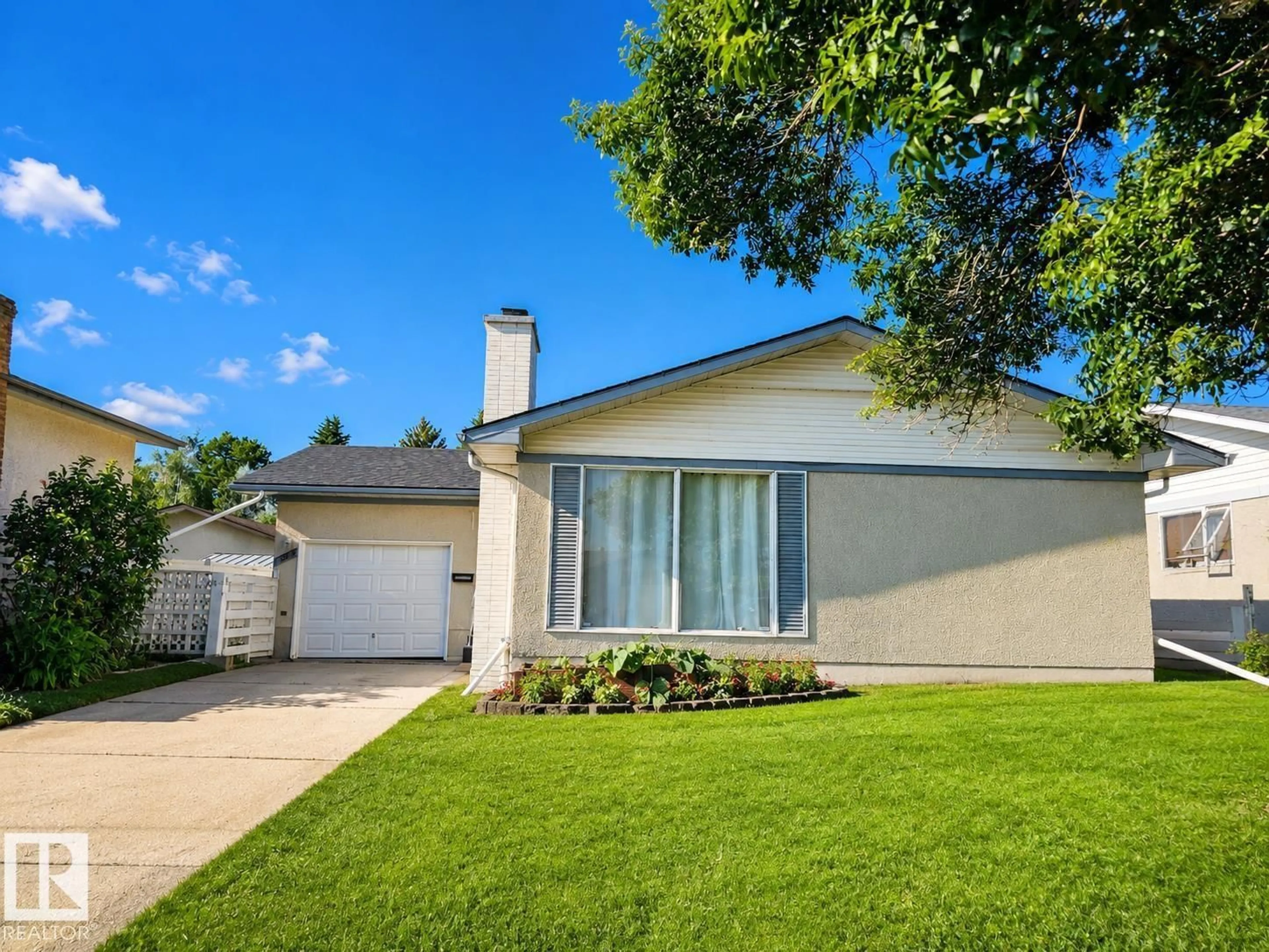 Home with vinyl exterior material, street for 7812 144 AV, Edmonton Alberta T5C2S1