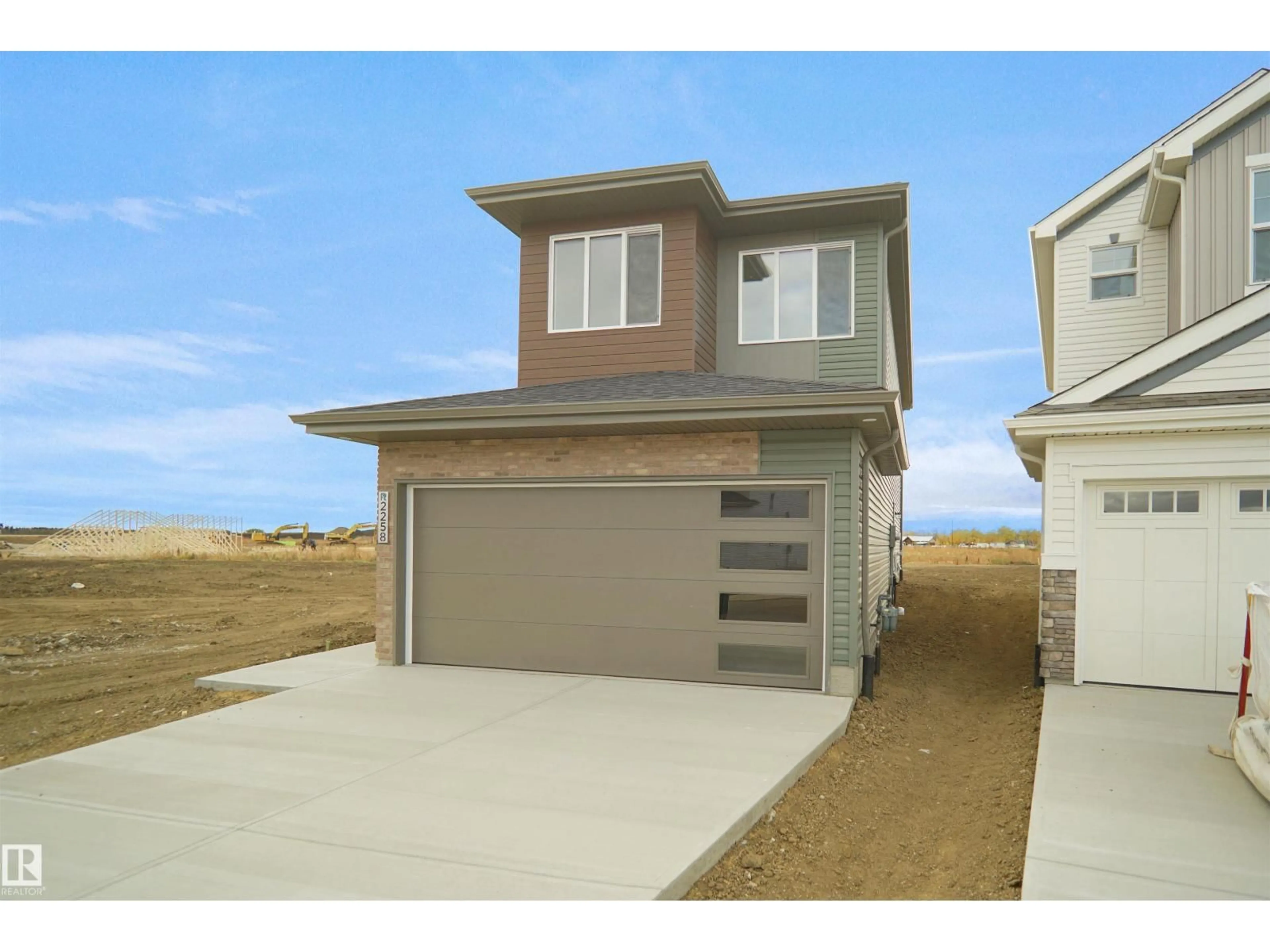 Home with vinyl exterior material, street for 8436 183 AV, Edmonton Alberta T5Z0X5