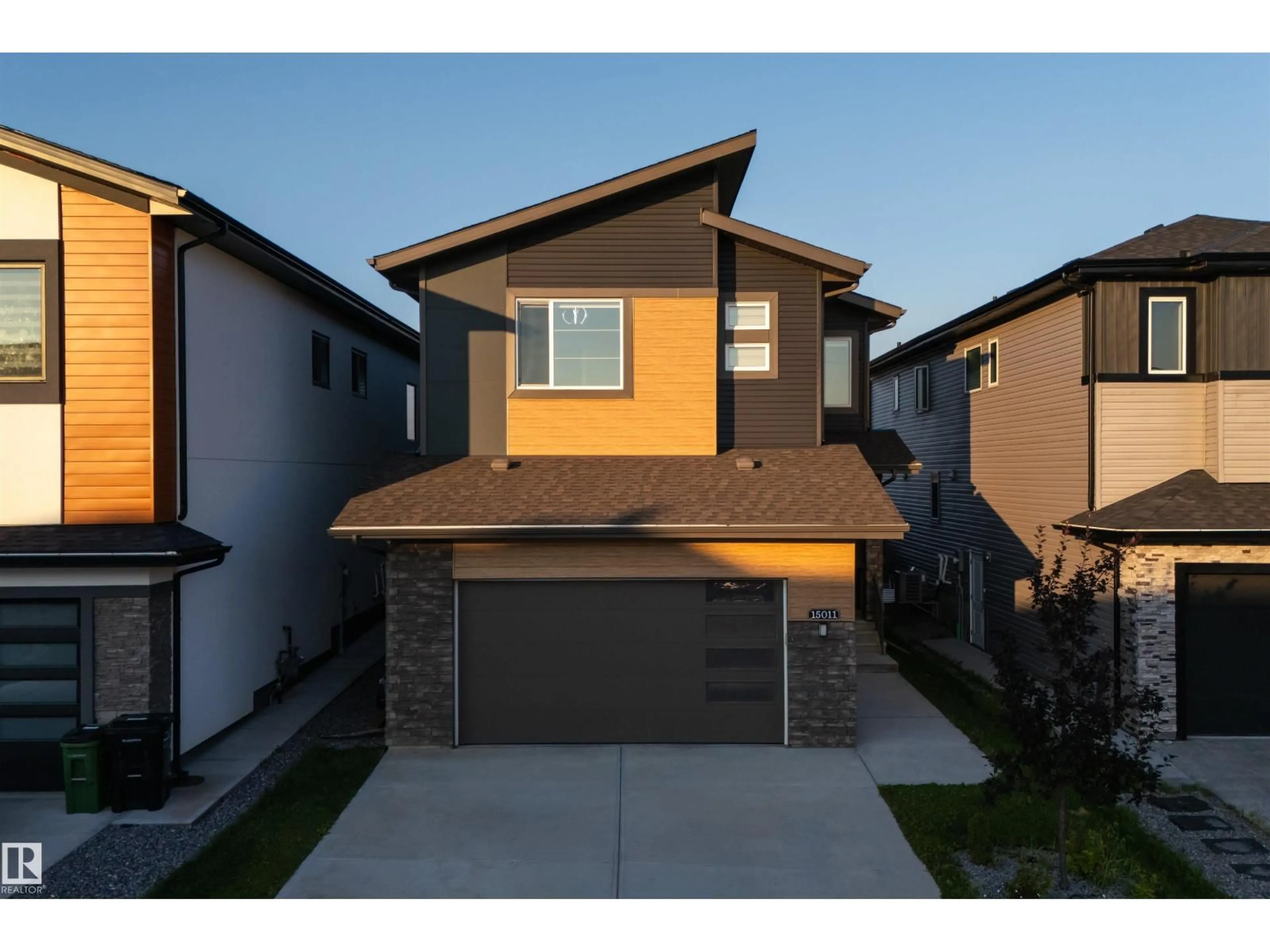 Home with vinyl exterior material, street for NW - 15011 10 ST, Edmonton Alberta T5Y4C8