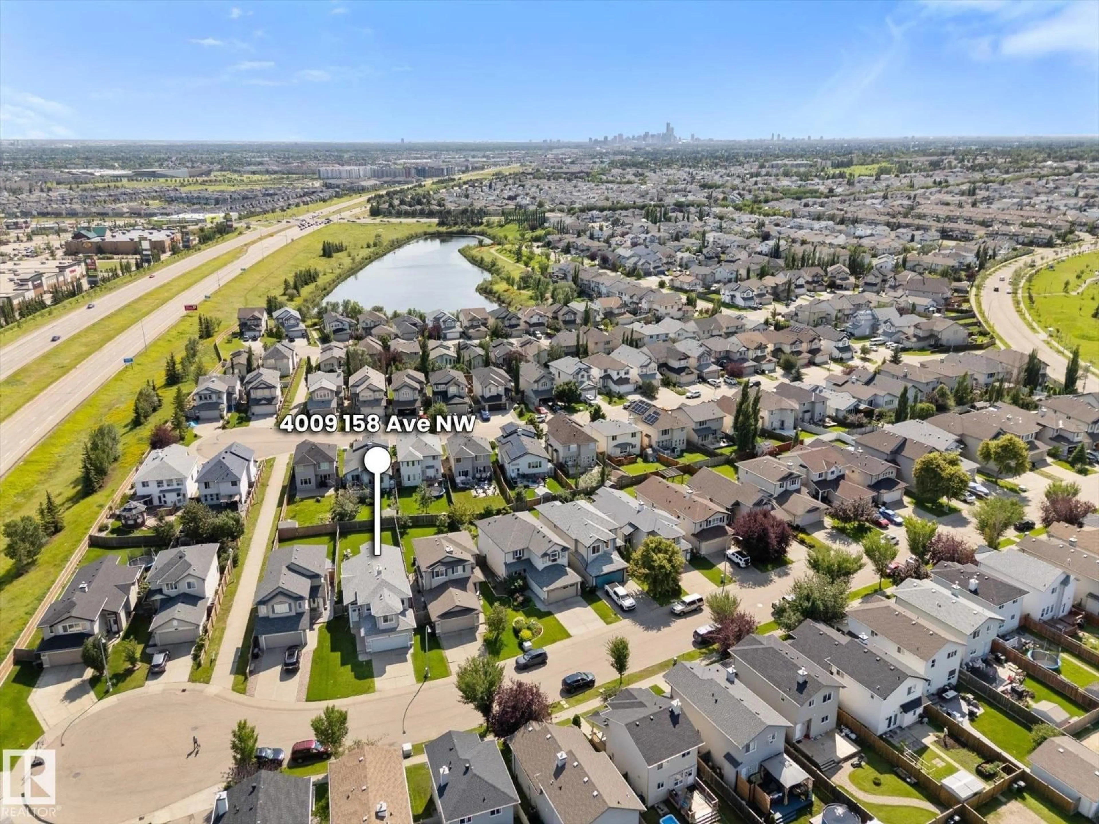 A pic from outside/outdoor area/front of a property/back of a property/a pic from drone, street for 4009 158 AV, Edmonton Alberta T5Y0A3