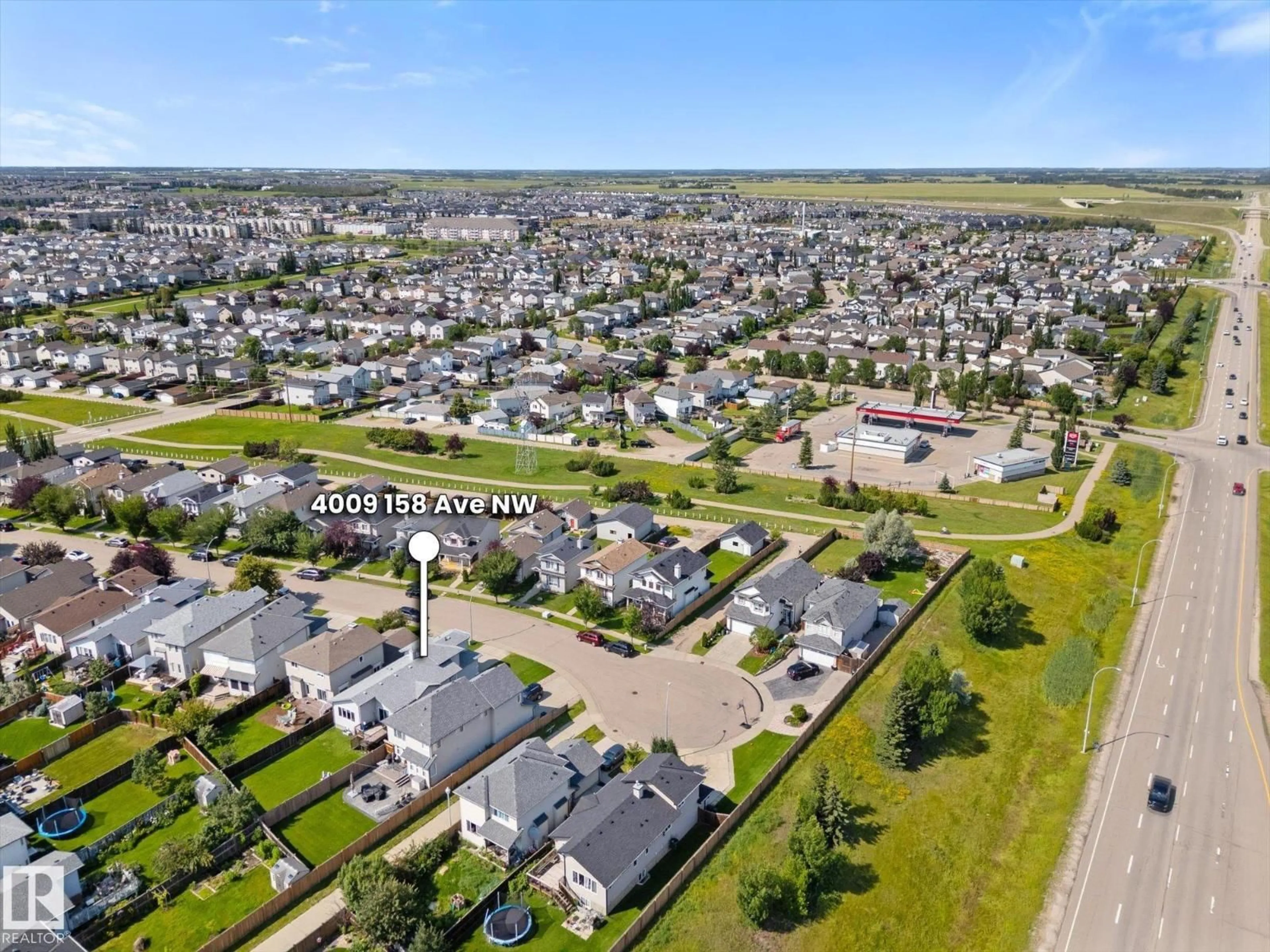 A pic from outside/outdoor area/front of a property/back of a property/a pic from drone, street for 4009 158 AV, Edmonton Alberta T5Y0A3