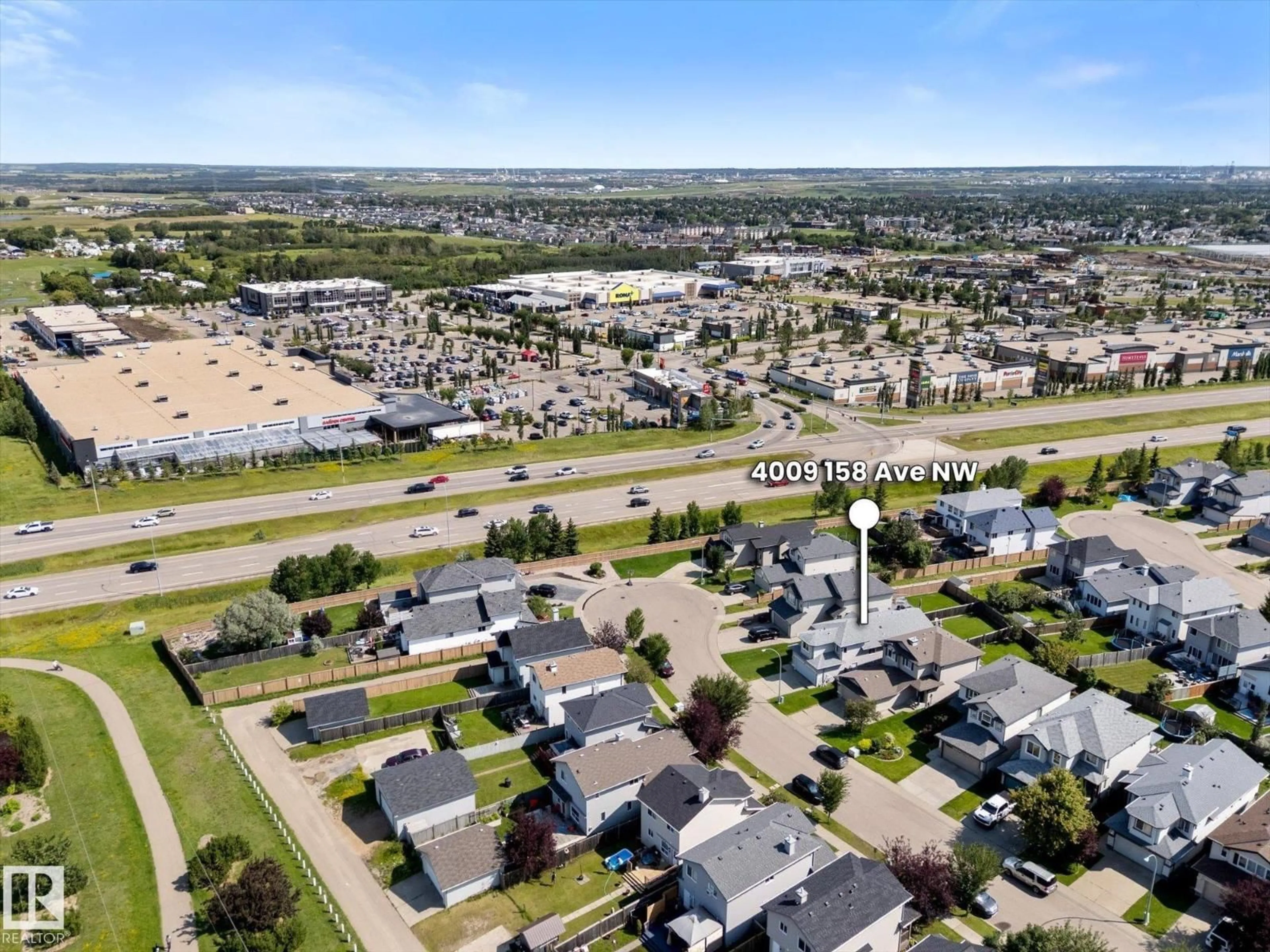 A pic from outside/outdoor area/front of a property/back of a property/a pic from drone, street for 4009 158 AV, Edmonton Alberta T5Y0A3