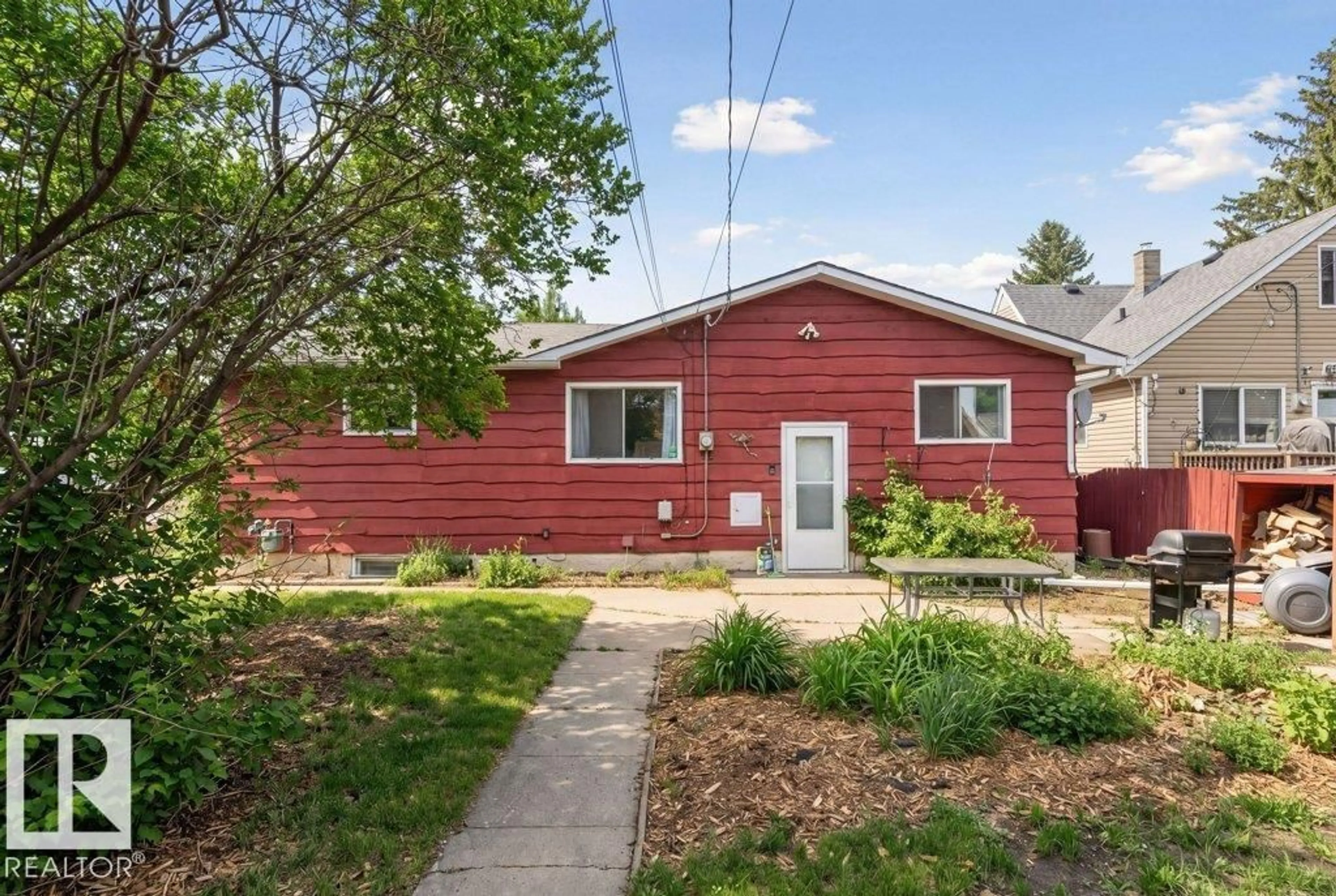 Home with vinyl exterior material, street for 10459 66 AV, Edmonton Alberta T6H1X2