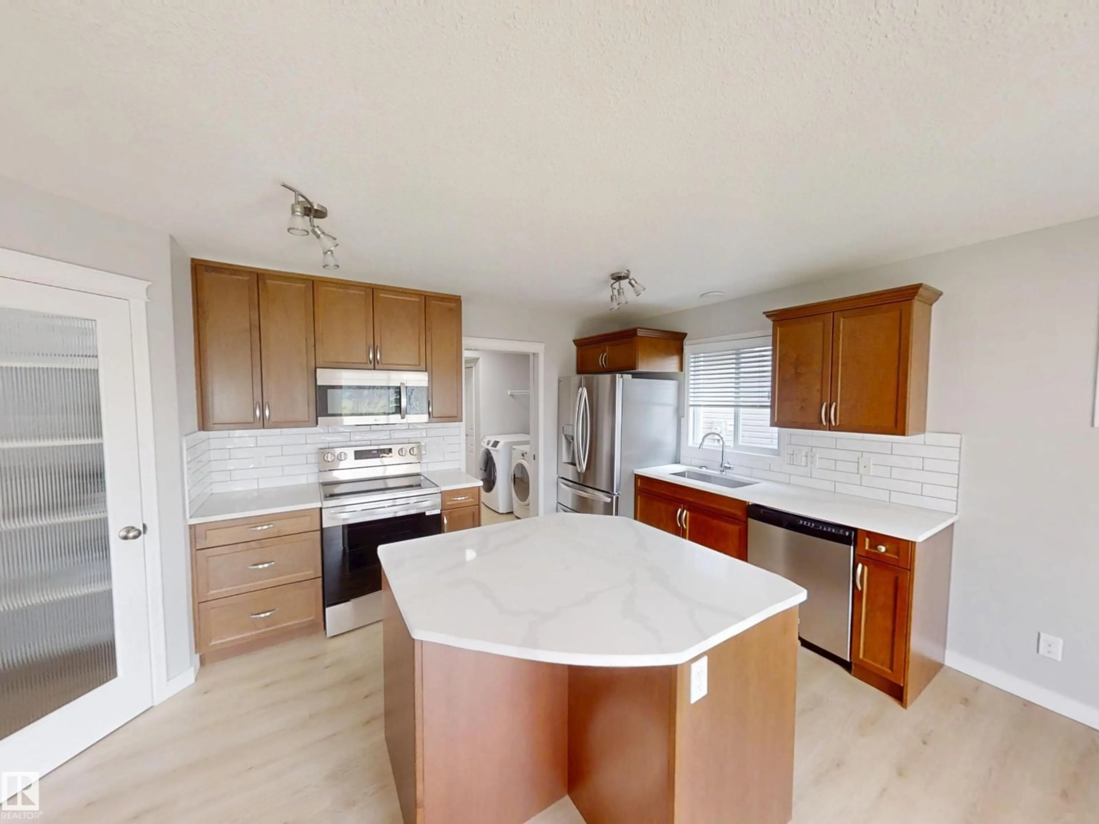 Open concept kitchen, ceramic/tile floor for 21107 58 AV, Edmonton Alberta T6M0H3