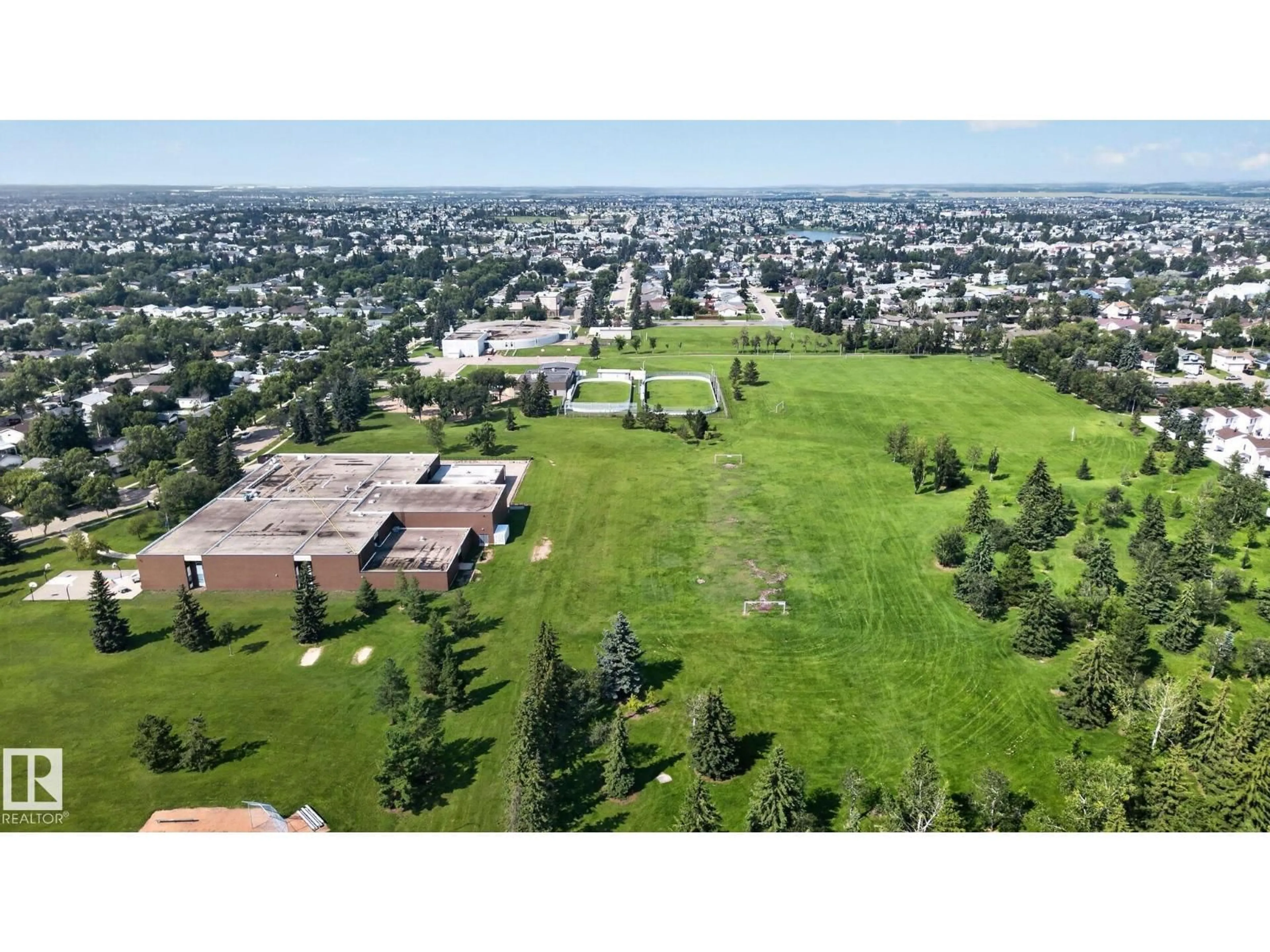 A pic from outside/outdoor area/front of a property/back of a property/a pic from drone, mountain view for NW - 6012 145 AV, Edmonton Alberta T5A1S7