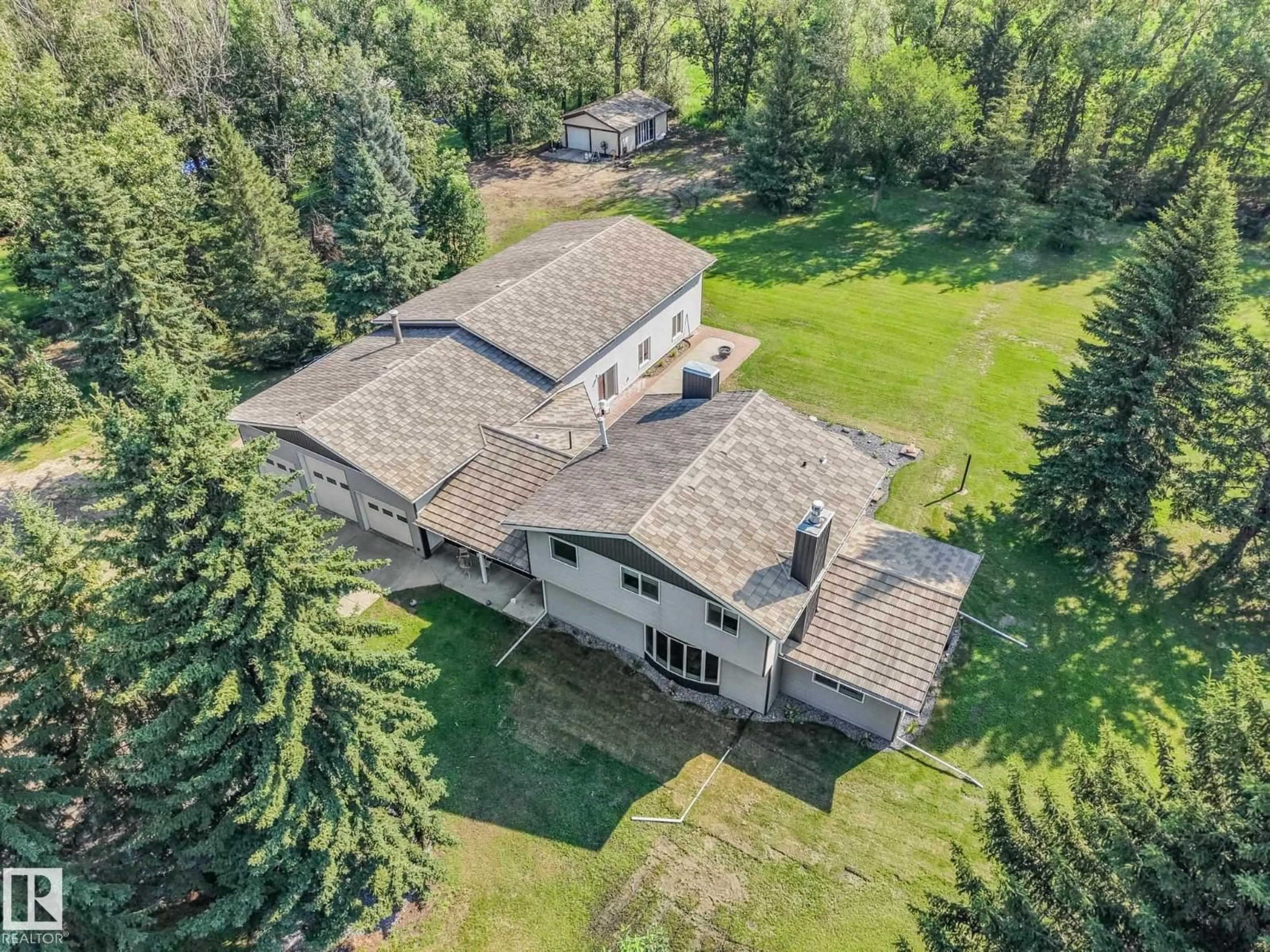 A pic from outside/outdoor area/front of a property/back of a property/a pic from drone, unknown for 50 50202 RGE RD 244, Rural Leduc County Alberta T4X0P4