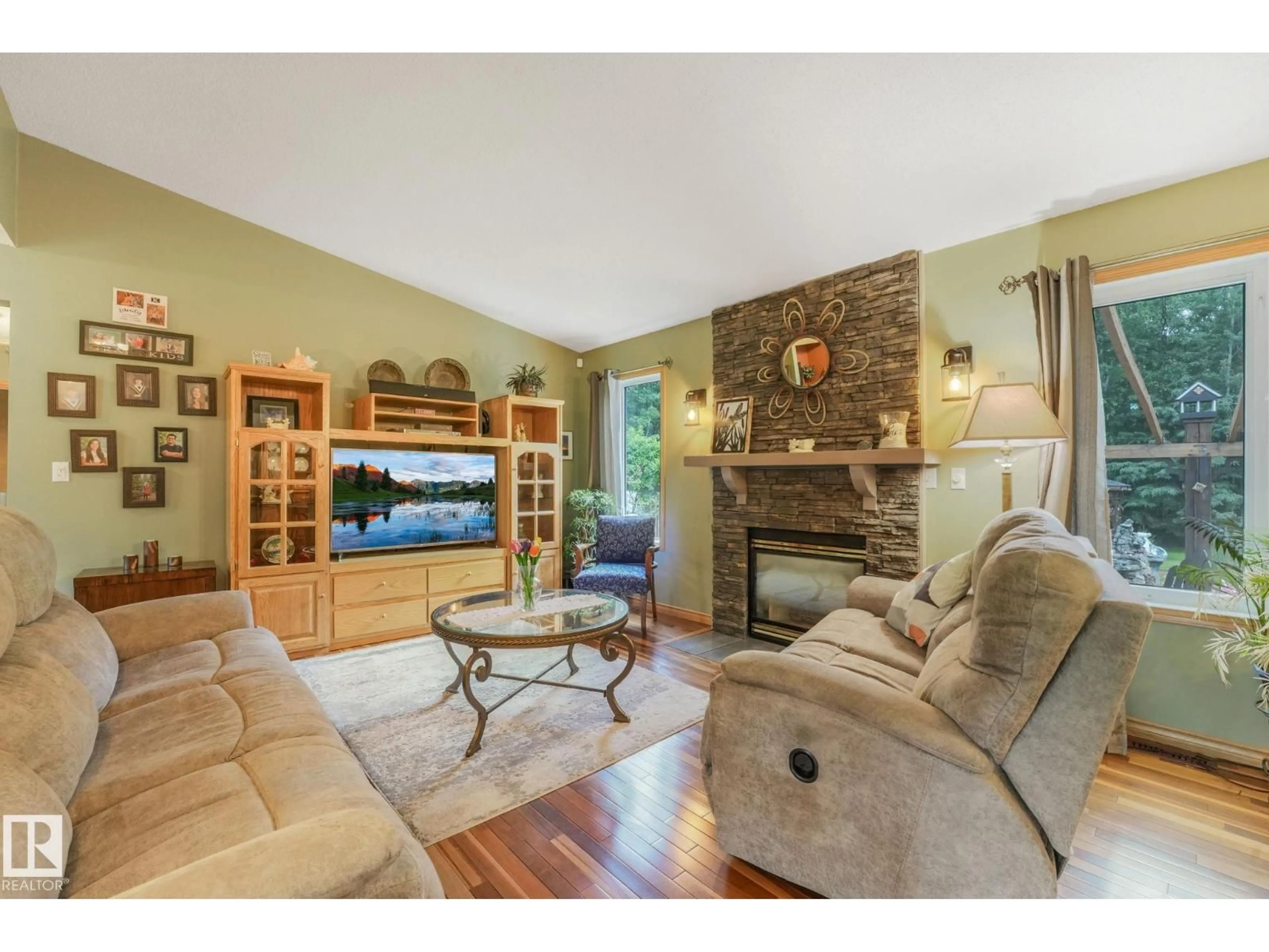 Living room with furniture, wood/laminate floor for 21252 - 170 TWP ROAD 530, Rural Strathcona County Alberta T8G2C4