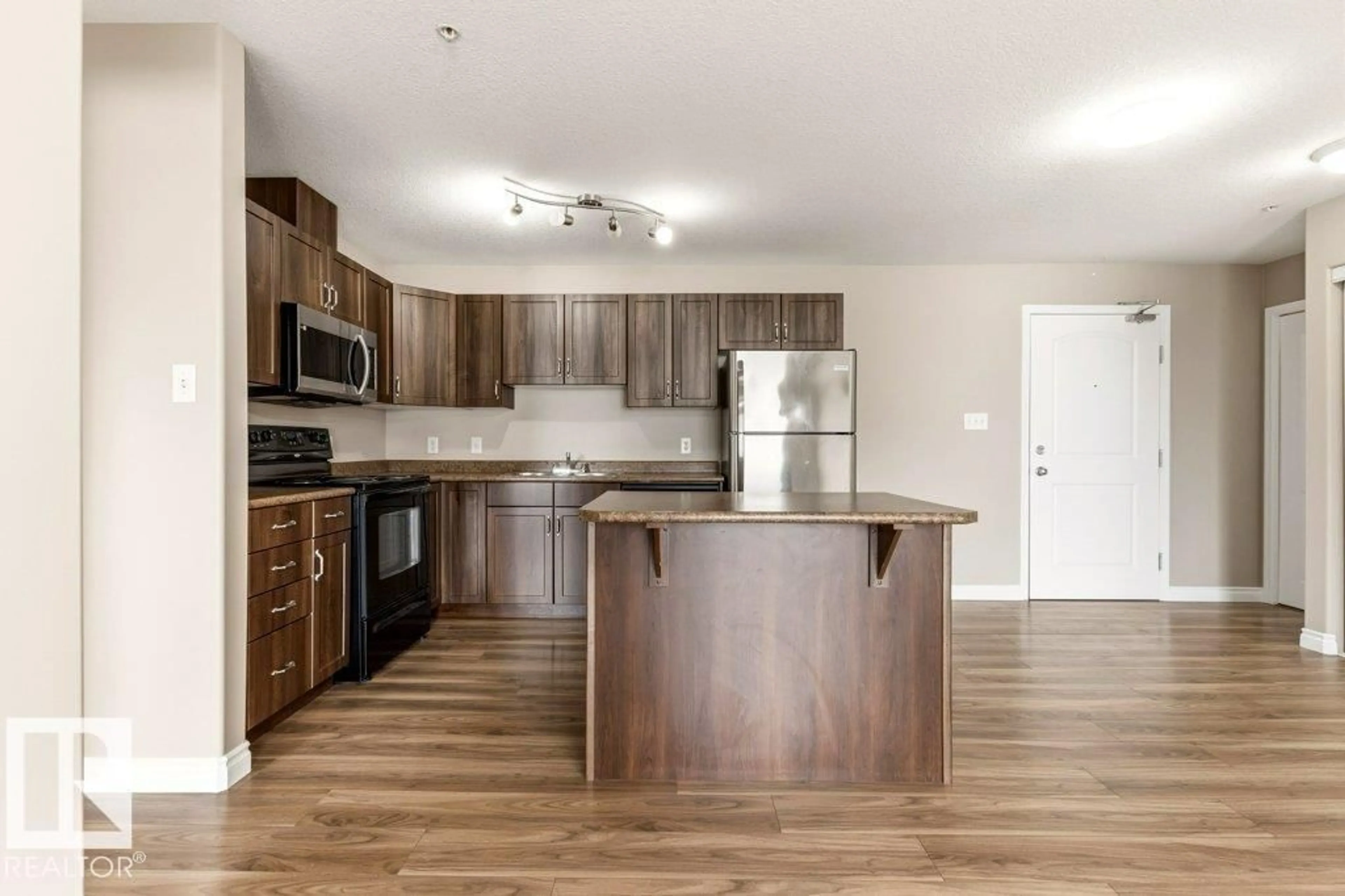 Open concept kitchen, wood/laminate floor for 336 WOODSMERE CL, Fort Saskatchewan Alberta T8L4N9